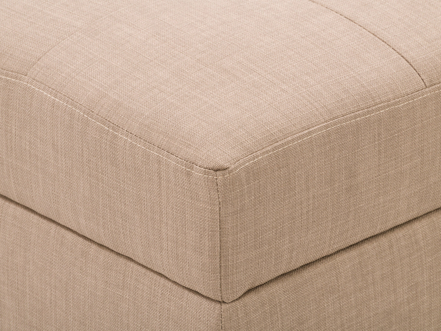 Tufted storage ottoman in light grey fabric with button-tufted top, wooden legs in dark finish, and hidden compartment for storage. Ideal for living room seating and organization.