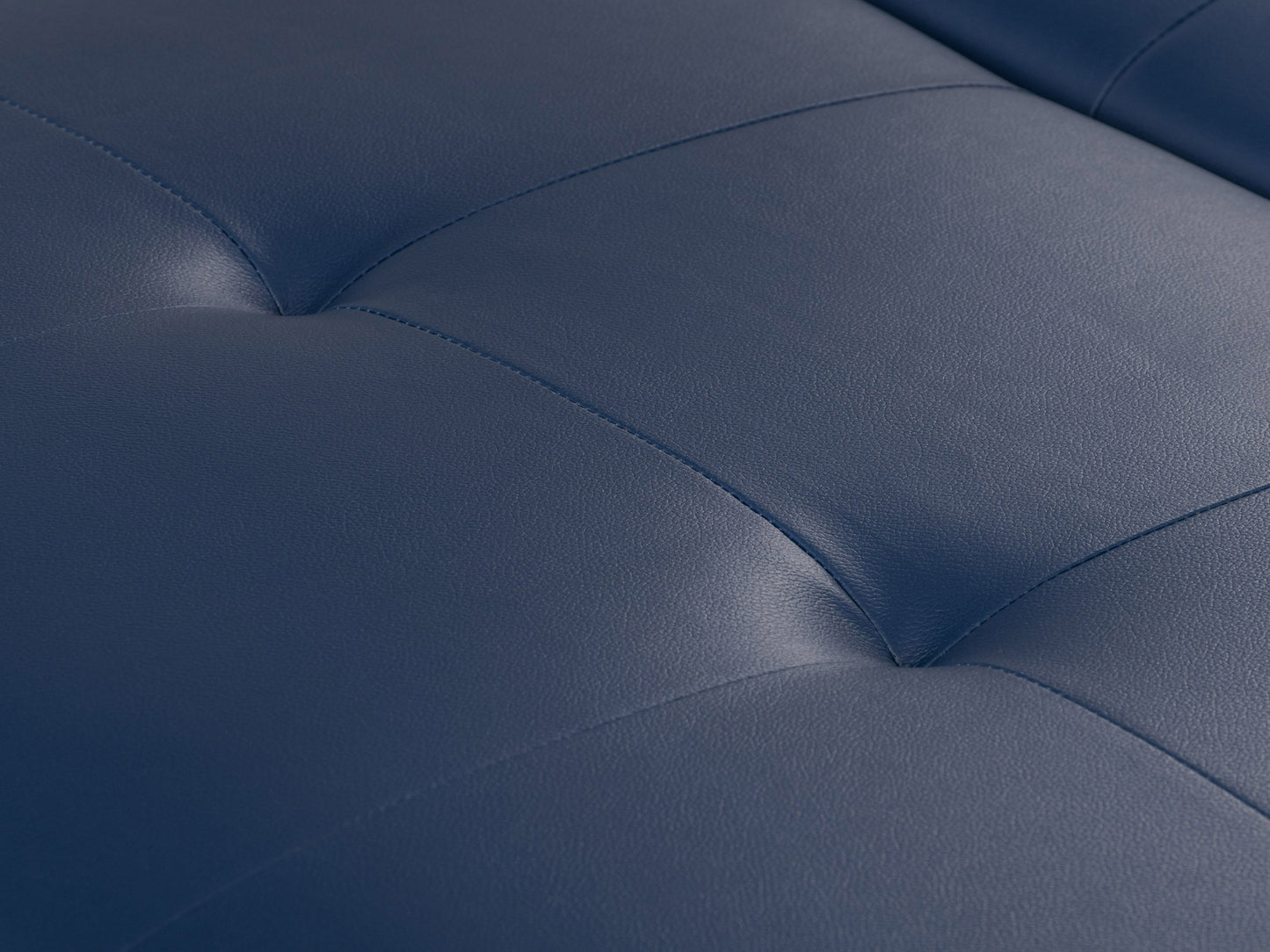 Blue upholstered ottoman with tufted top, wooden legs, and built-in storage compartment. Ideal for living room or bedroom decor, offering both seating and organizational solutions.