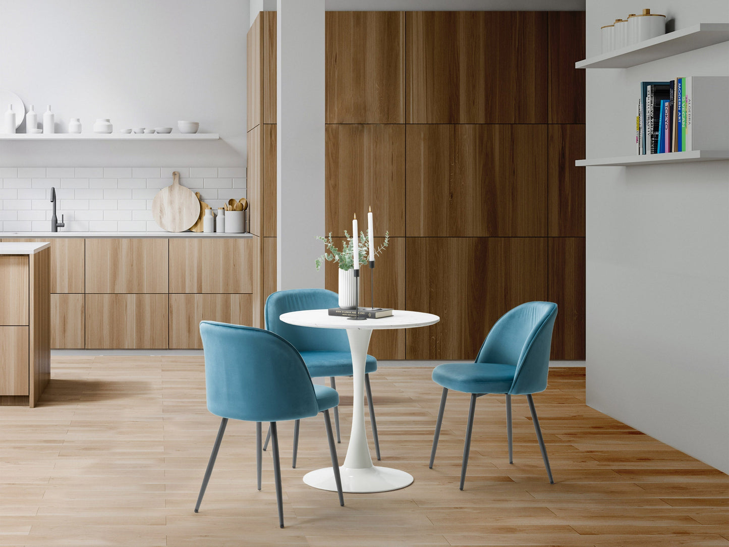 Blue velvet dining chair with gold metal legs, featuring a curved backrest and plush cushioning for comfort. The chair's luxurious velvet upholstery and sleek design make it ideal for modern dining rooms or stylish home offices.