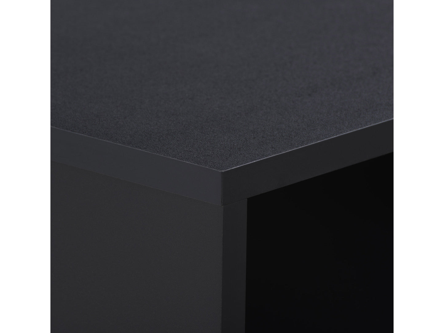 Mid-century black desk with sleek lines, wooden legs, and a smooth matte finish. Features two spacious drawers with minimalist handles, ideal for modern home offices or study spaces.
