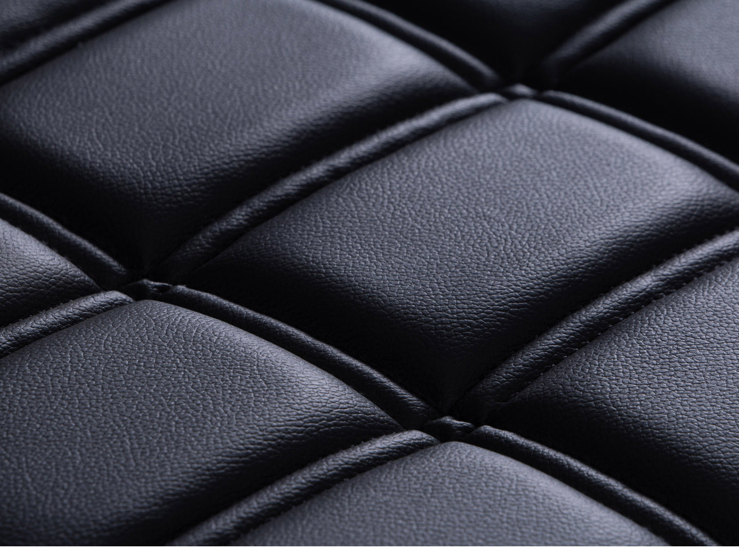 Black leather bench with sleek, modern design featuring a sturdy metal frame, tufted seat cushion, and minimalist style, perfect for contemporary living spaces or entryways.