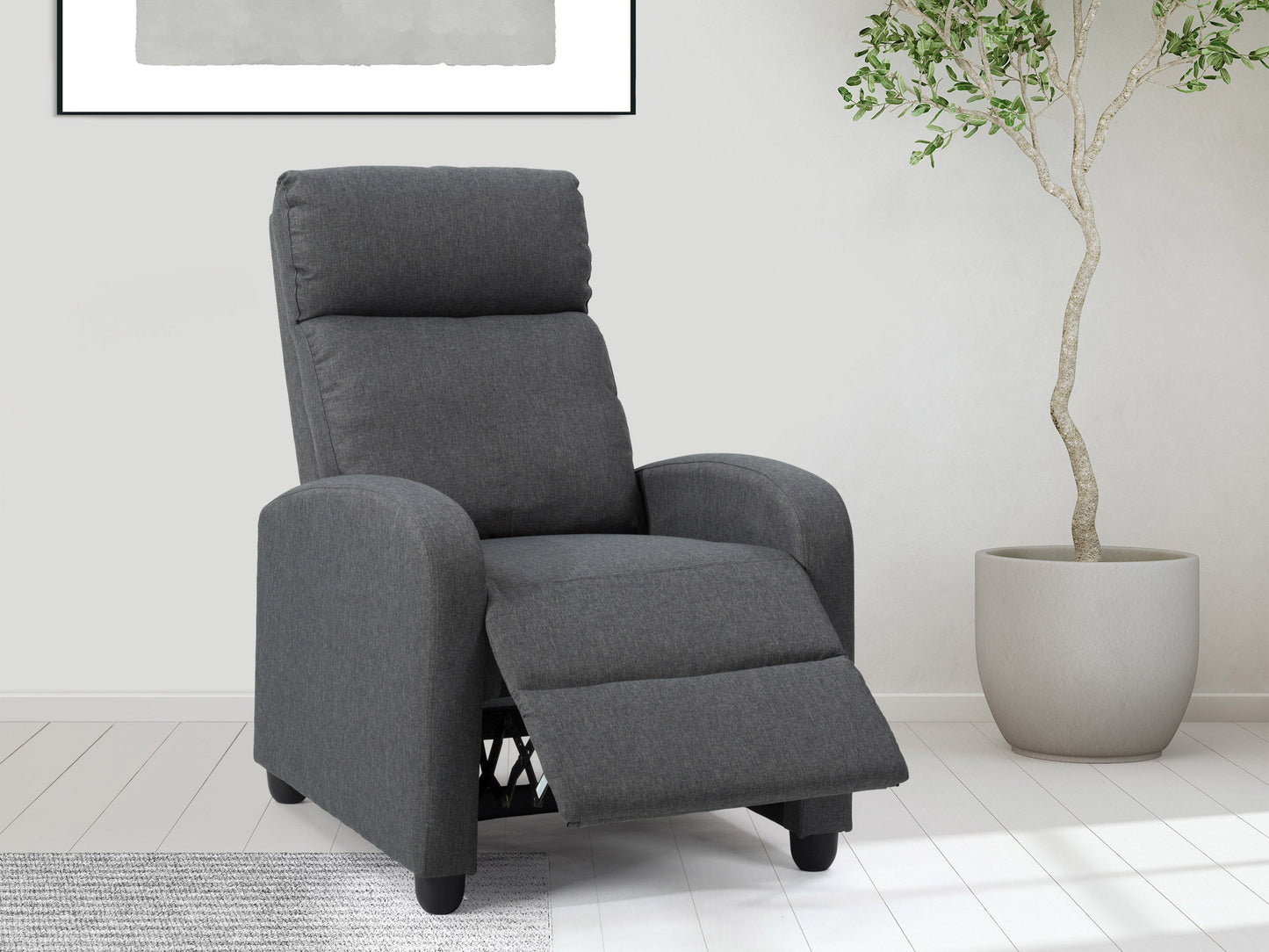 Dark grey push back recliner with plush cushioning, sleek armrests, and durable fabric upholstery. Ideal for living rooms, this comfortable and stylish chair features a reclining mechanism for ultimate relaxation.