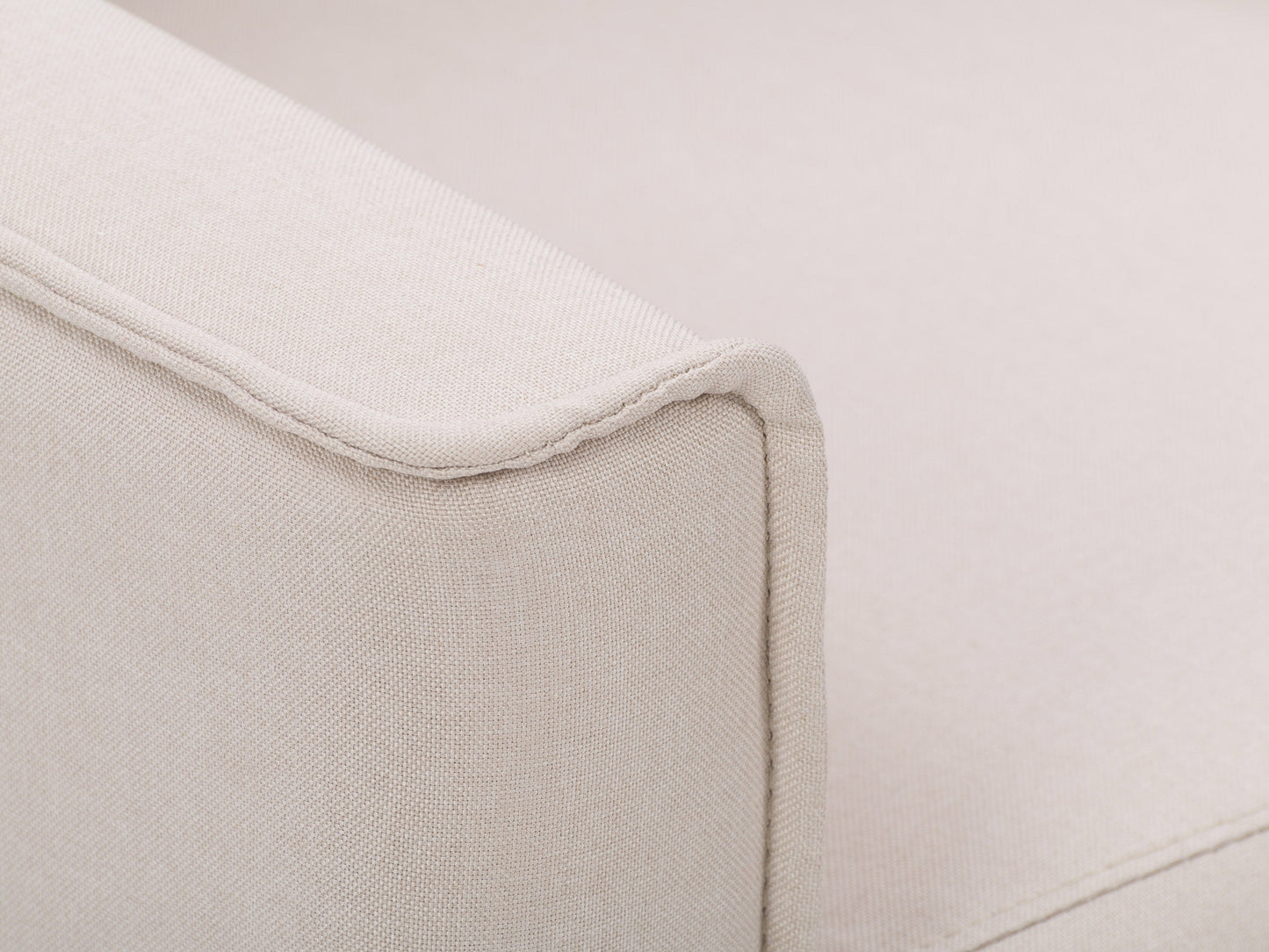 Beige mid-century recliner with wooden legs, tufted backrest, and soft fabric upholstery, featuring a sleek, minimalist design perfect for modern living rooms.