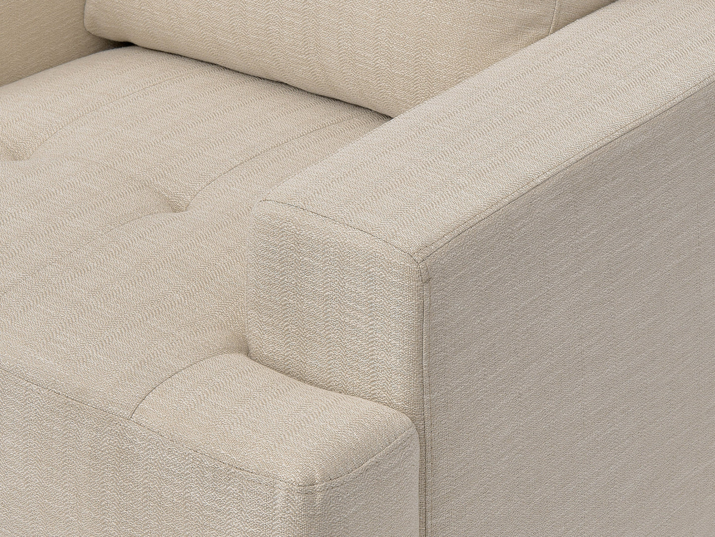 Beige mid-century armchair with wooden legs, tufted backrest, and smooth upholstery. Ideal for living rooms or offices, this stylish chair combines comfort with a retro design aesthetic.