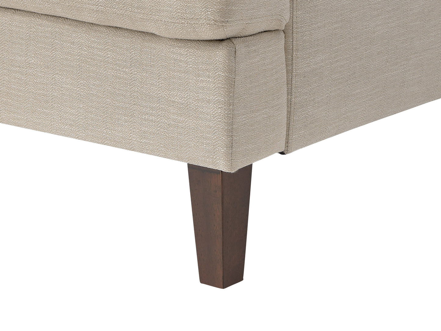 Beige mid-century armchair with wooden legs, tufted backrest, and smooth upholstery. Ideal for living rooms or offices, this stylish chair combines comfort with a retro design aesthetic.