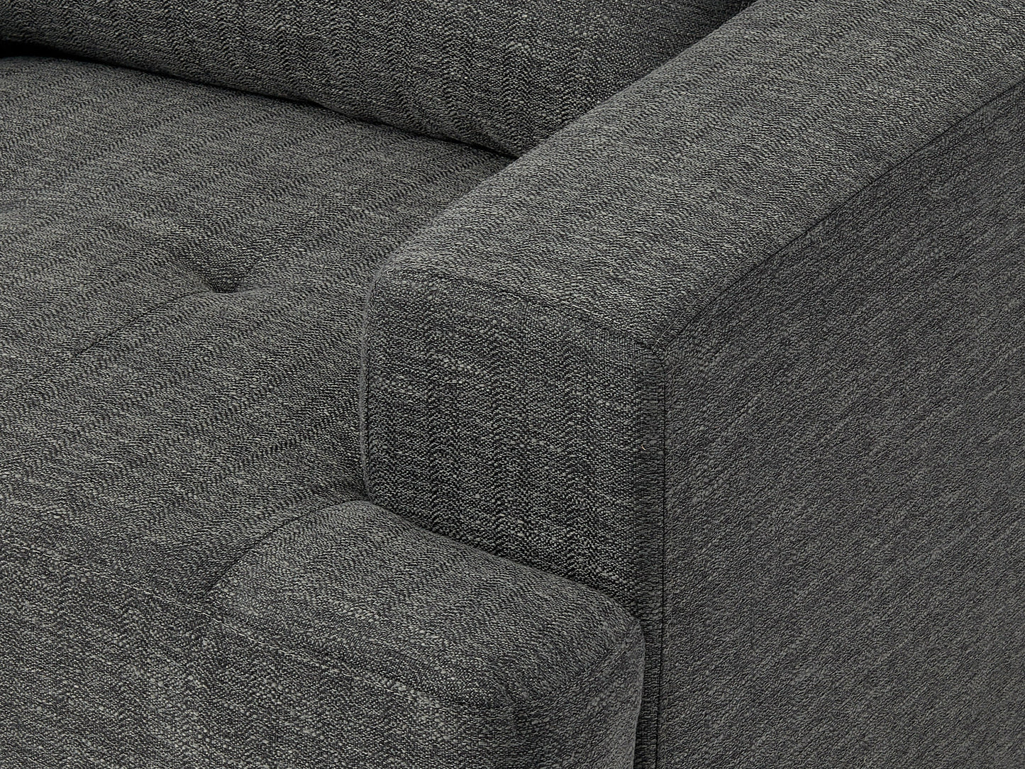 Dark grey mid-century armchair with wooden legs, upholstered in soft fabric, featuring a tufted backrest and padded seat, ideal for modern living rooms or offices.
