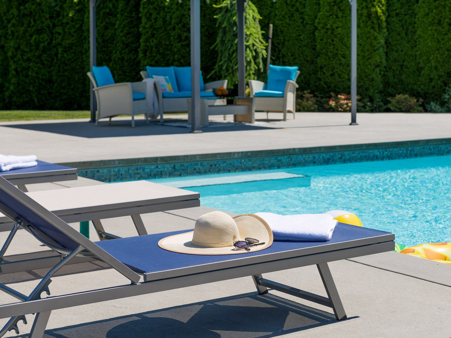 Blue patio recliner lounge chair with plush cushioning, ergonomic design, and durable metal frame. Features adjustable backrest and weather-resistant fabric, perfect for outdoor relaxation.