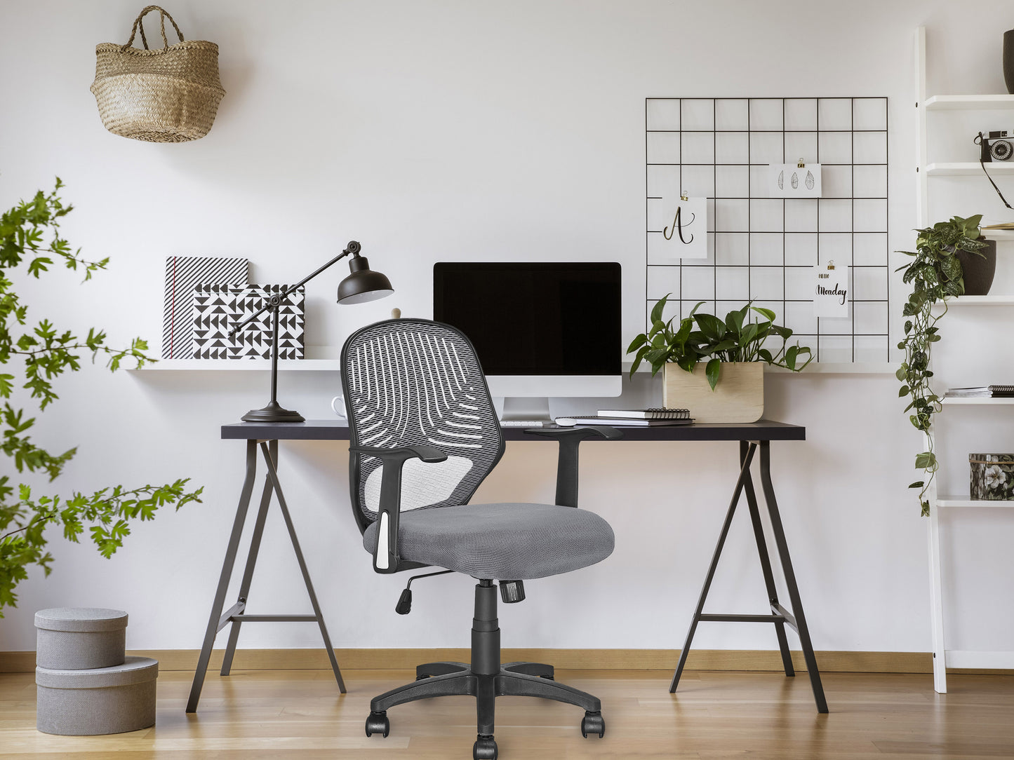Grey mesh office chair with ergonomic design, adjustable armrests, lumbar support, and swivel base. Ideal for home or office use, providing comfort and breathability for long hours of work.
