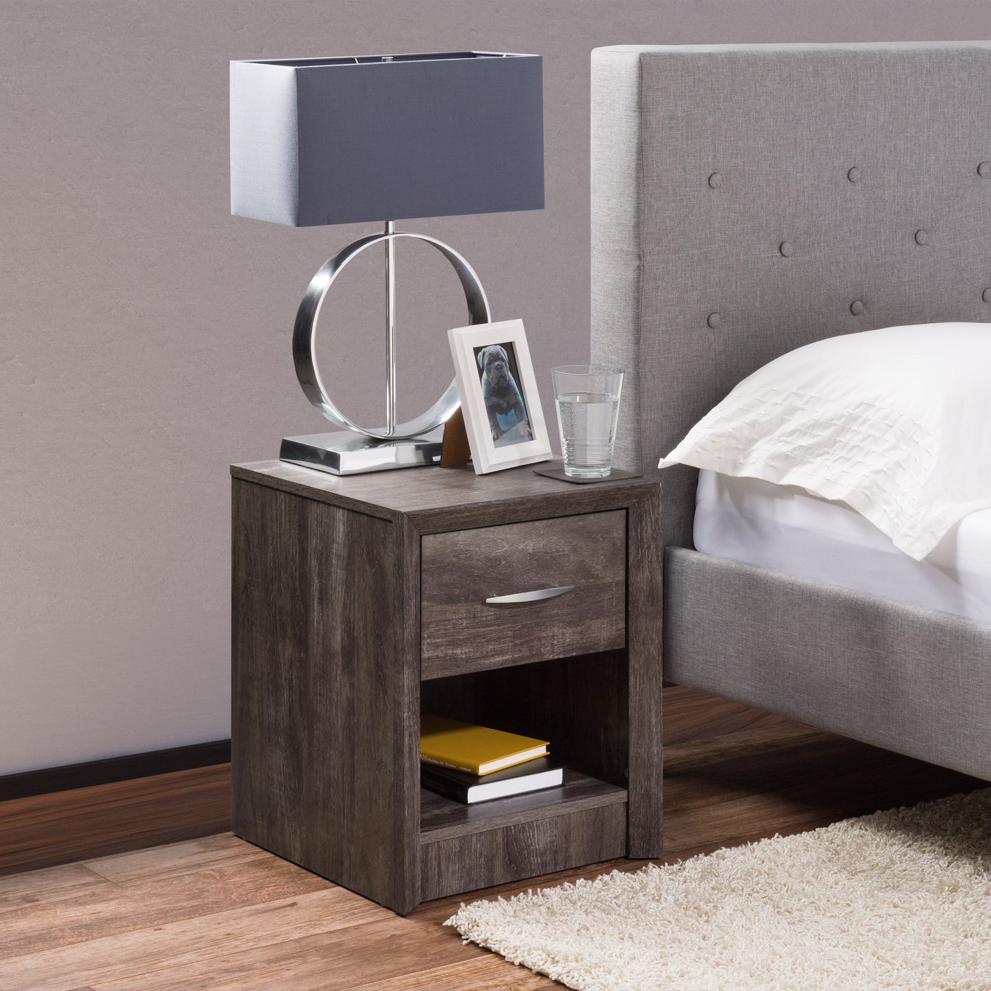 Mid-century modern nightstand with two walnut drawers, sleek black metal legs, and a smooth white top, perfect for bedroom storage and stylish decor.