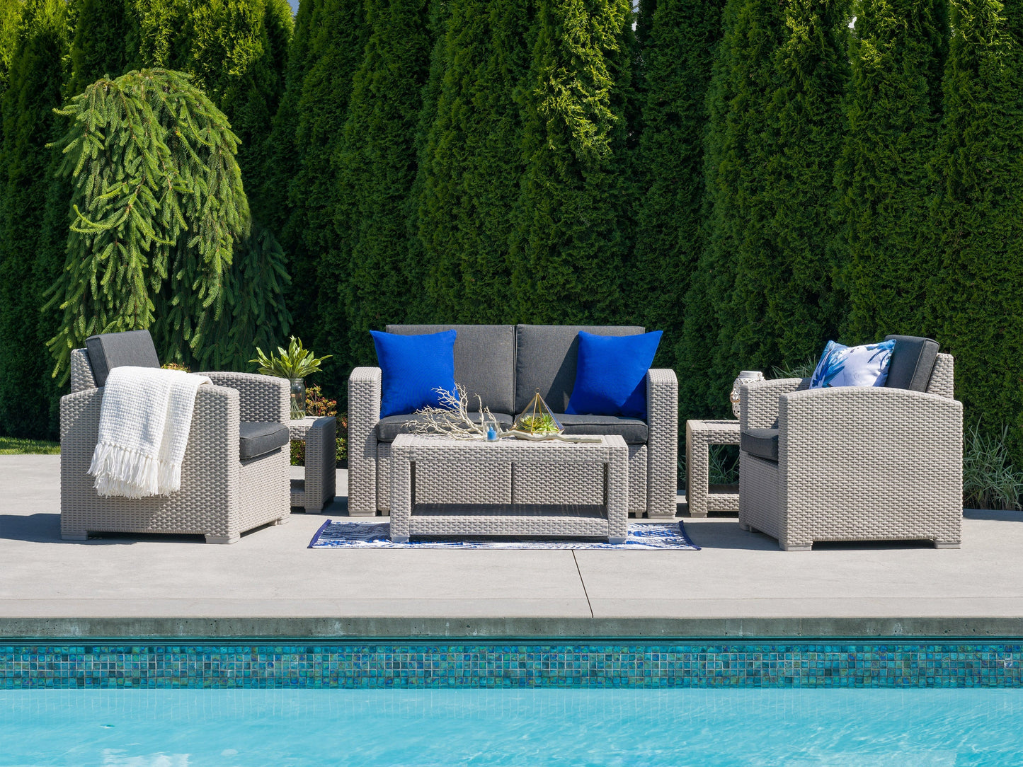 6-piece patio conversation set with gray cushions, black metal frames, and a rectangular coffee table, featuring a modern design ideal for outdoor lounging and entertaining.