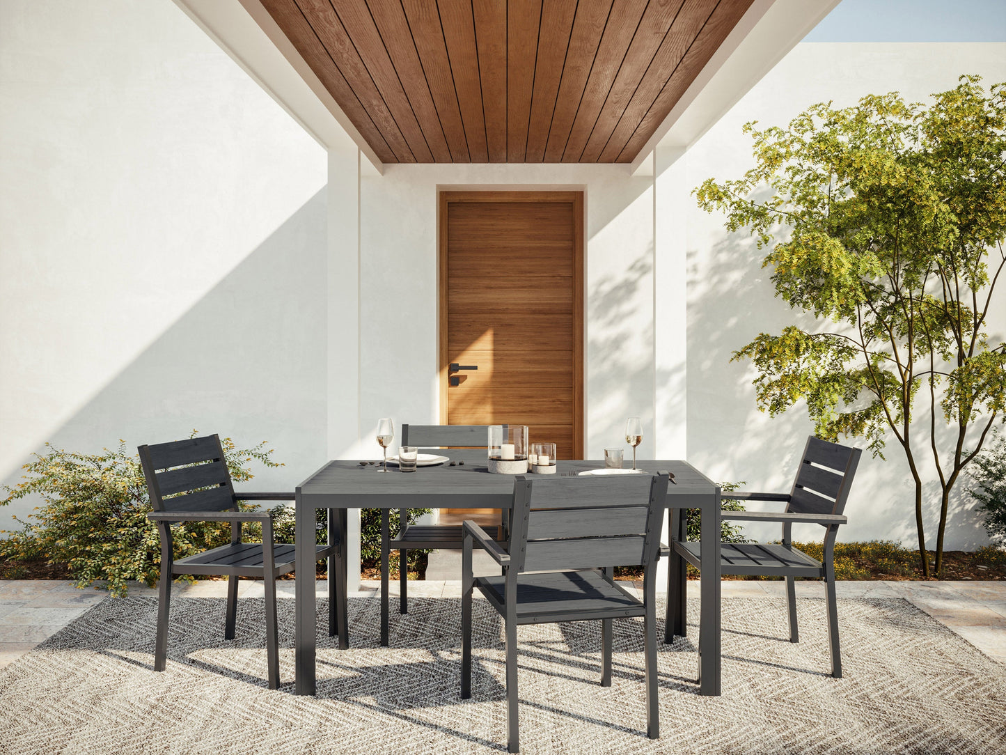 Modern outdoor dining set with a rectangular, glass-top table and four cushioned chairs in beige and brown wicker. Durable, weather-resistant materials perfect for patio or garden dining. Elegant and comfortable design.