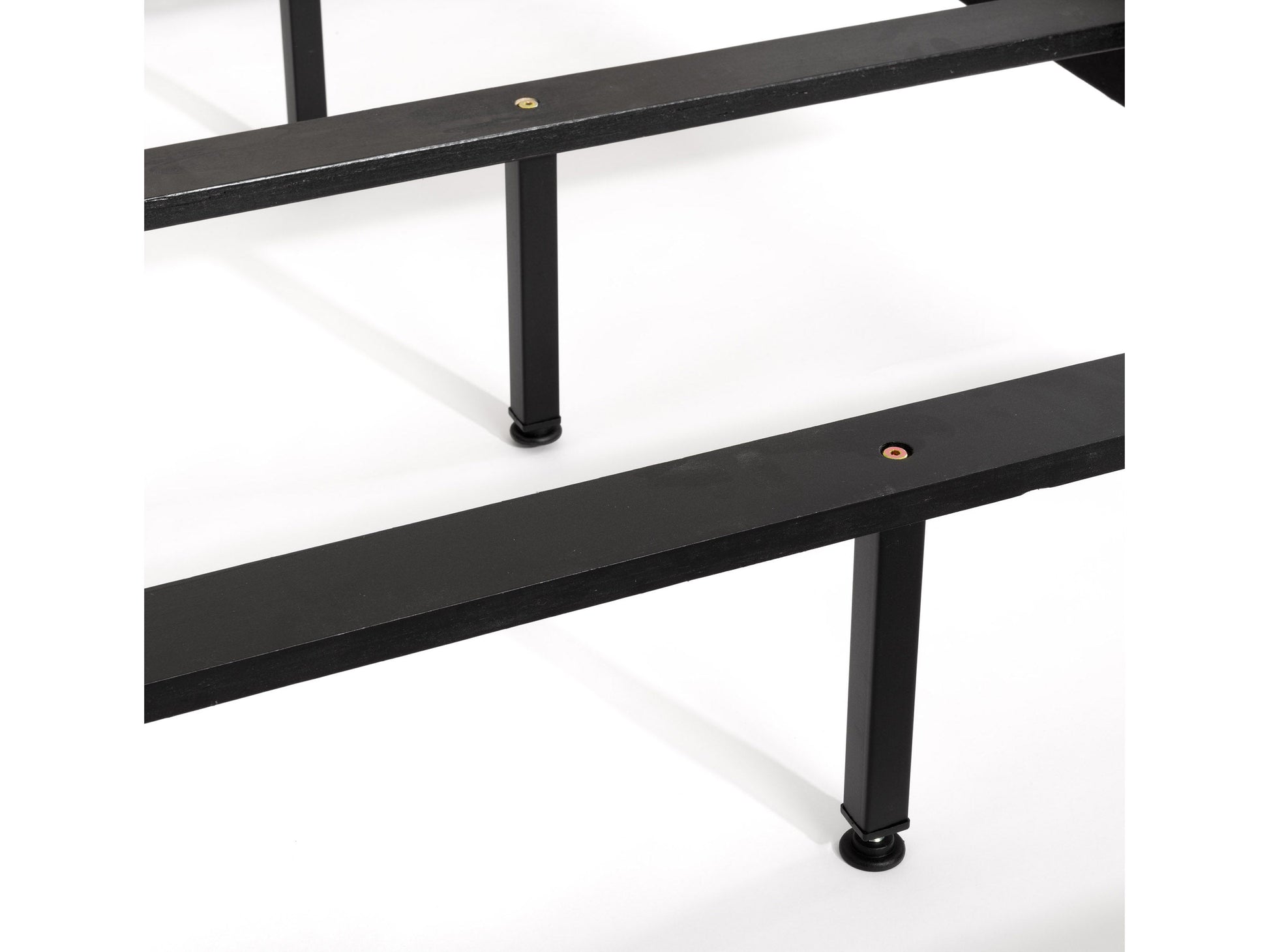 Dark grey tufted king bed with elegant button detailing on the headboard, upholstered in soft fabric. Sturdy wooden frame with sleek, modern design perfect for a contemporary bedroom.