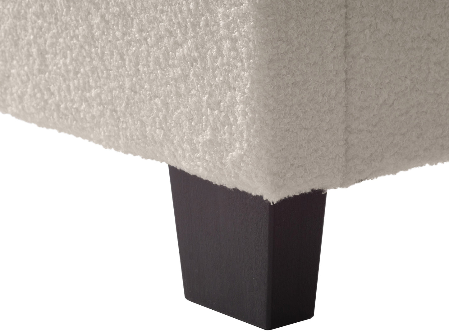 Cream boucle double/full bed with wooden legs, tufted headboard, and soft textured fabric, ideal for modern bedroom decor.