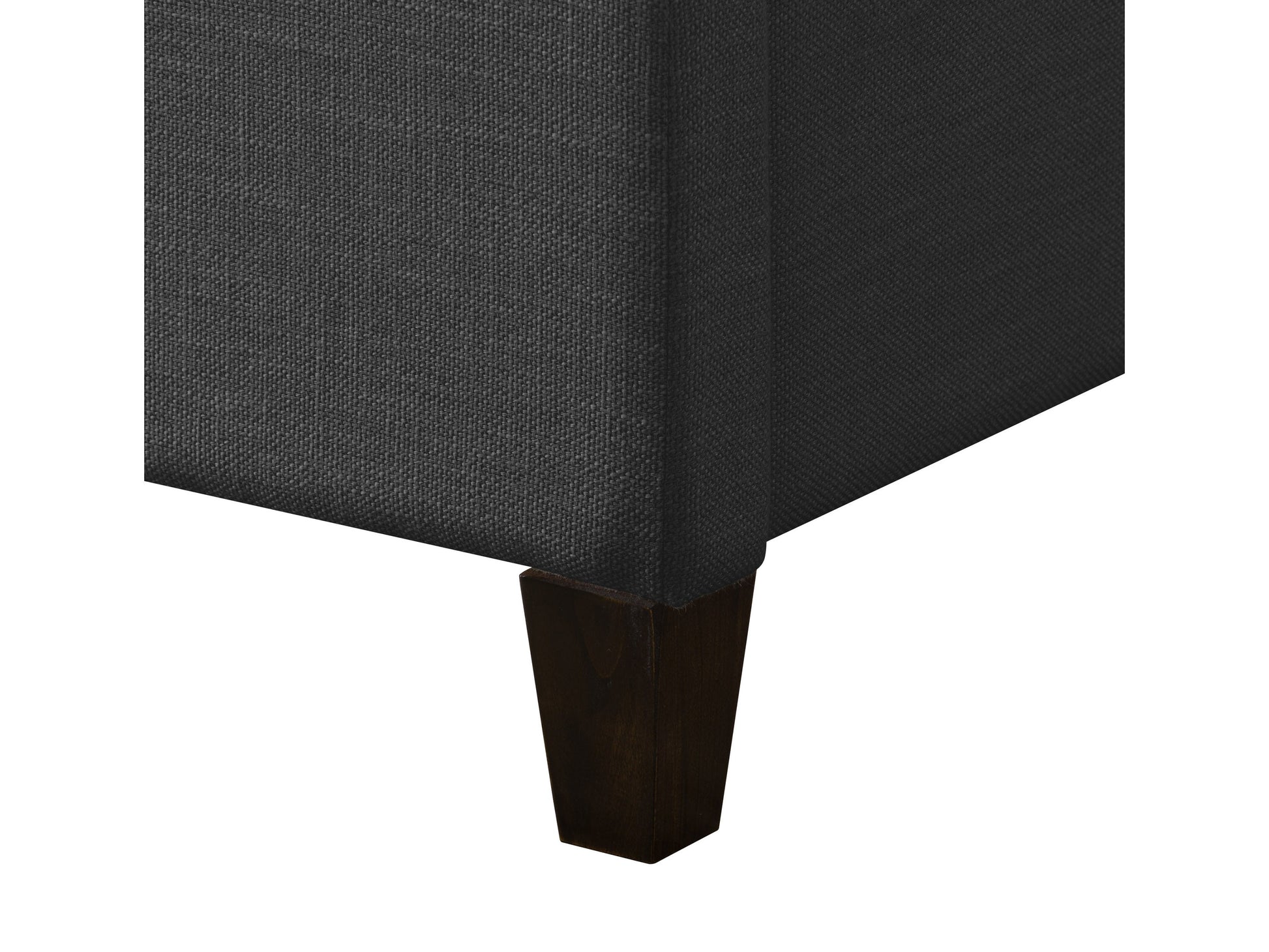 Dark grey upholstered king bed with tufted headboard, sturdy wooden frame, and plush fabric finish. Ideal for modern bedrooms, combining comfort and style with a sleek, contemporary design.
