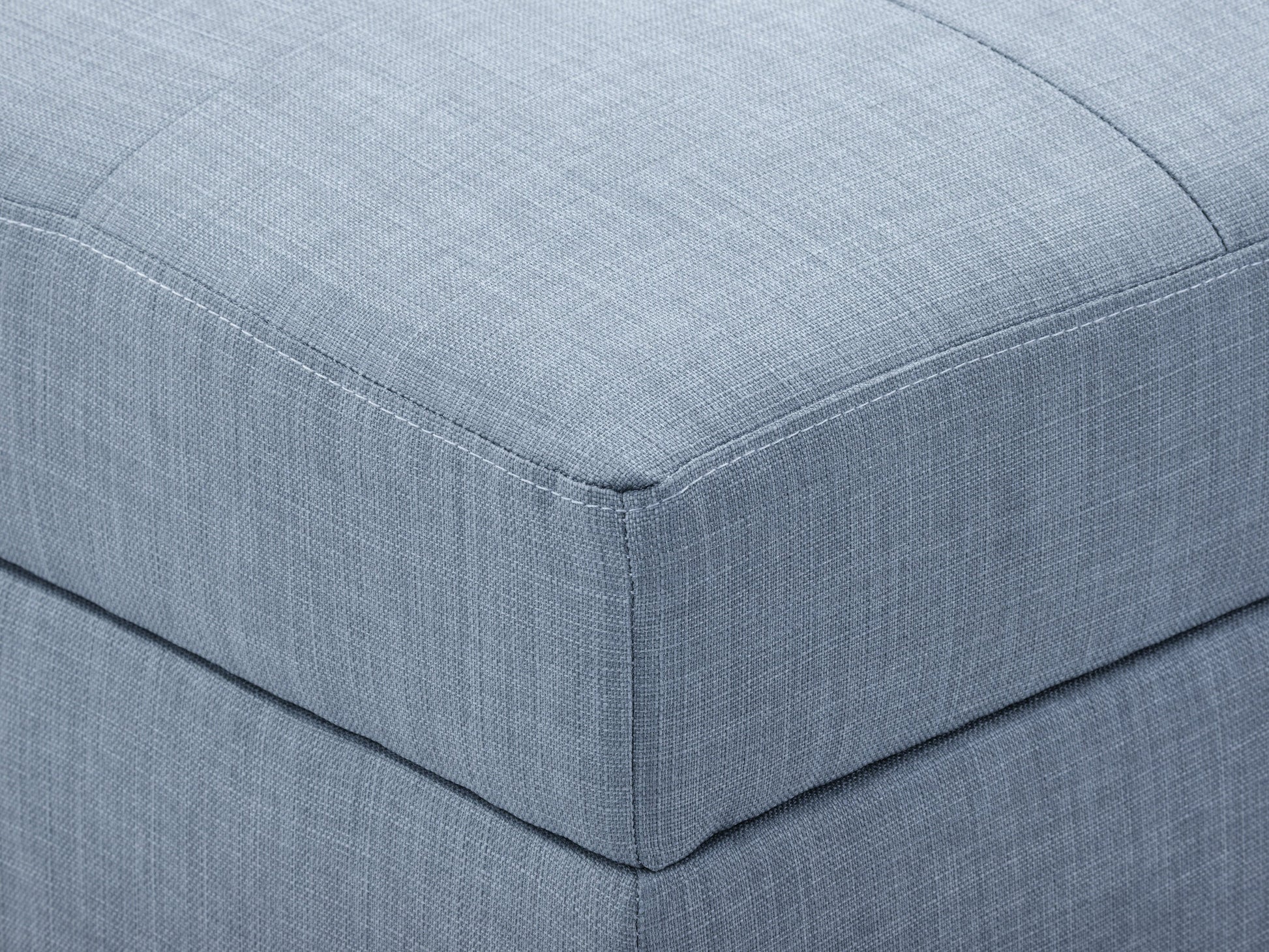 Tufted storage ottoman in light grey fabric with button detailing, wooden legs, and spacious interior storage. Ideal for living room or bedroom decor, combining style and functionality.