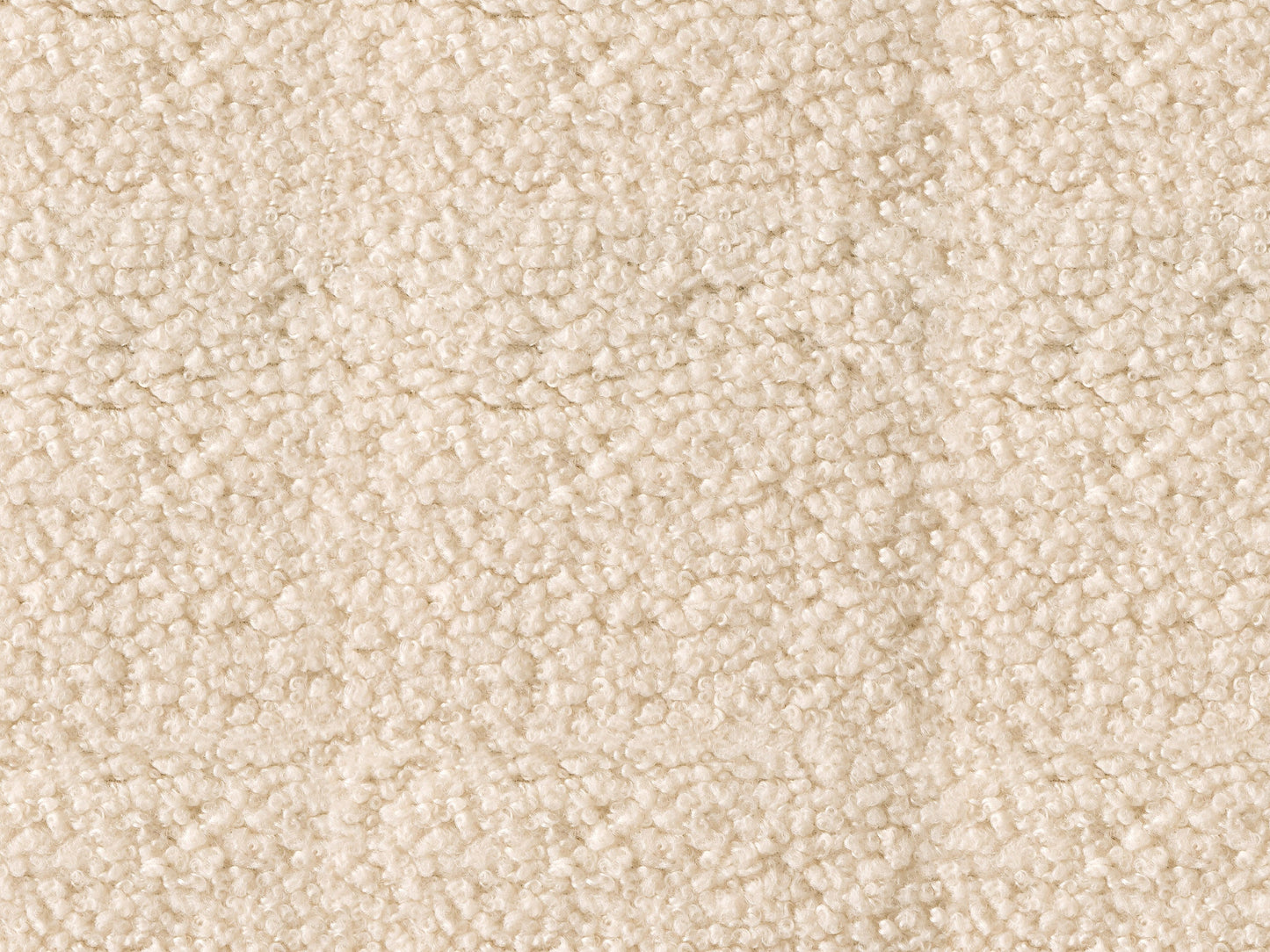 Cream boucle barrel accent chair with curved backrest, plush texture, and wooden legs. Chair features a modern design, perfect for living rooms or reading nooks.