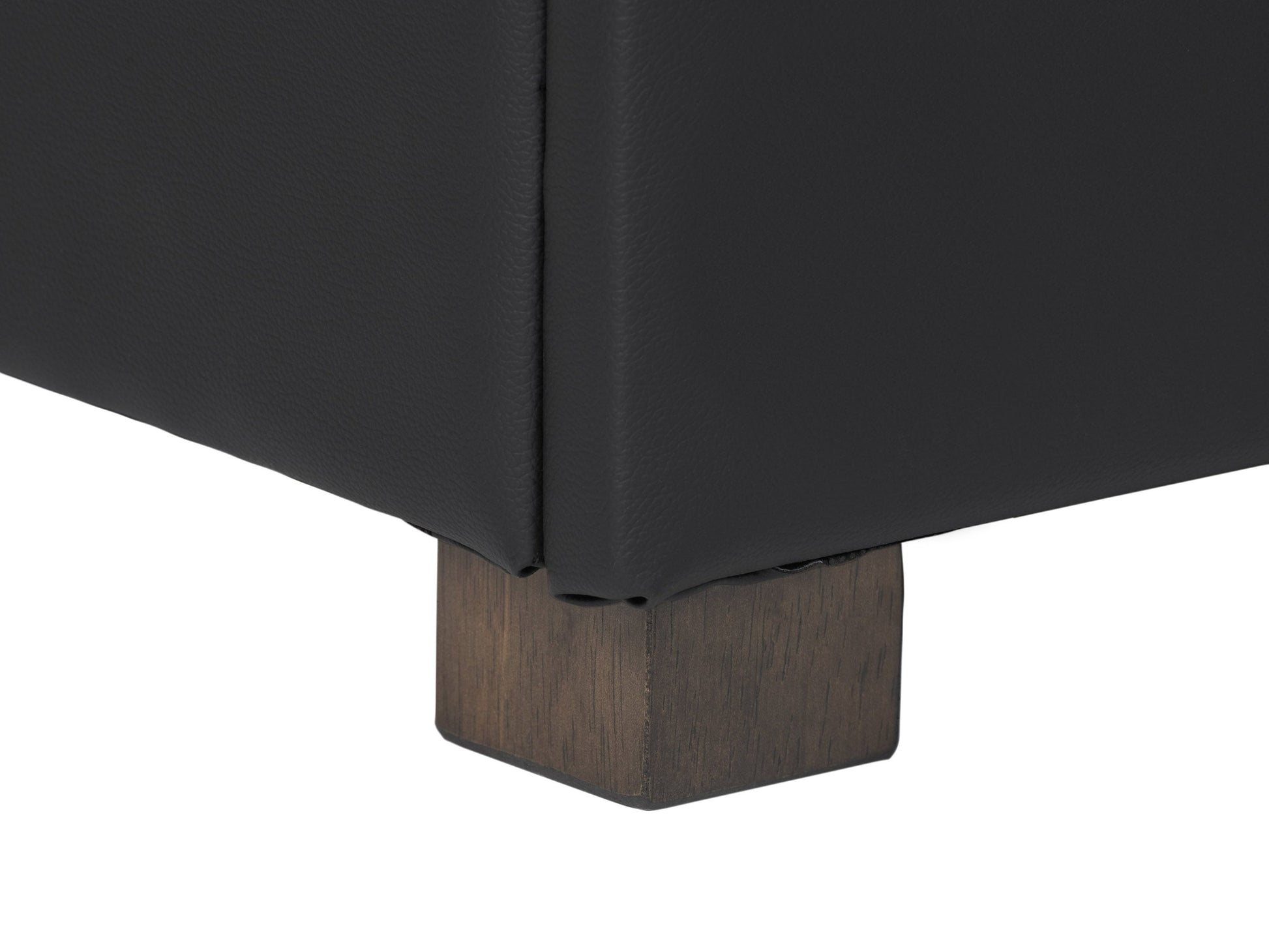 Matte black deluxe storage ottoman with tufted faux leather upholstery, spacious interior storage, and sleek minimalist design. Ideal for modern living rooms and versatile as extra seating or a coffee table.