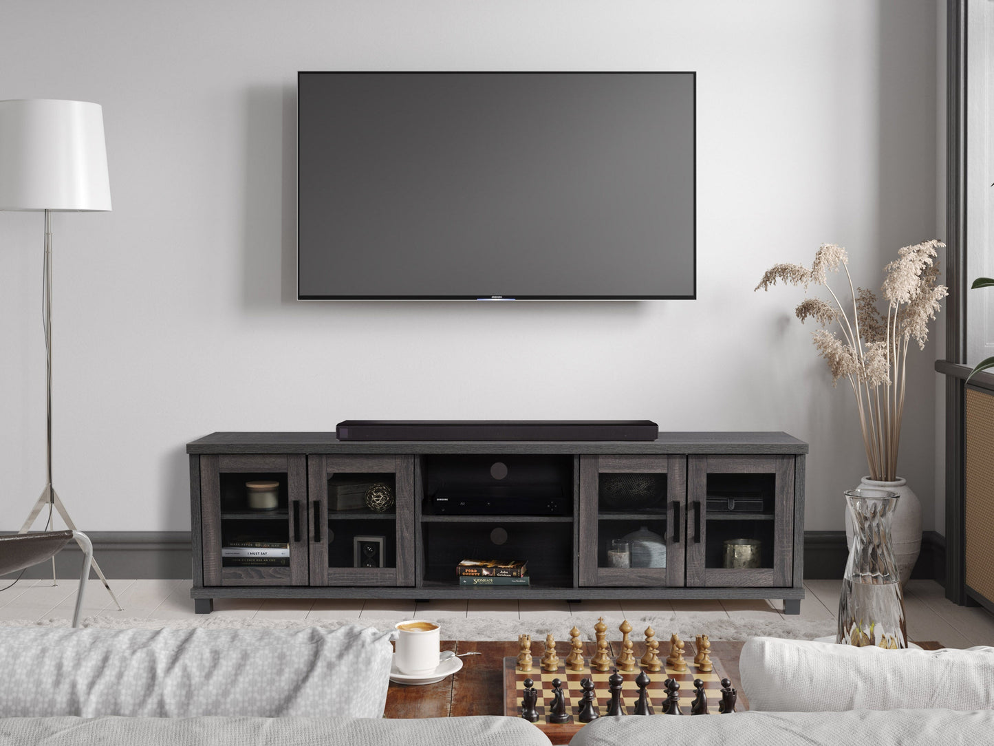 Dark grey TV stand for TVs up to 95 inches, featuring a sleek modern design, sturdy wooden construction, and ample storage with open shelves and closed cabinets. Ideal for contemporary living rooms.