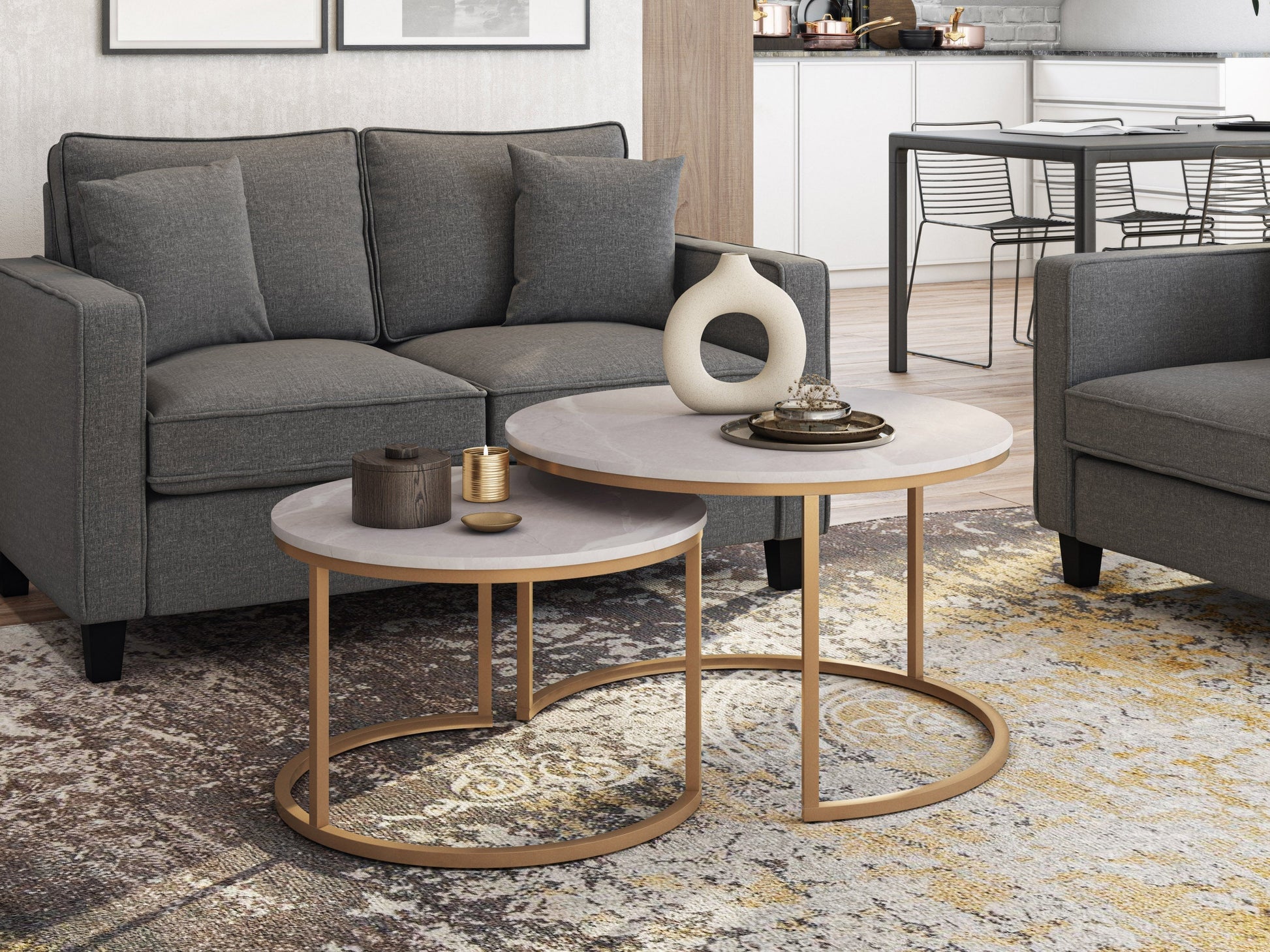 Round nesting coffee tables with white marble tops and gold metal frames, featuring a modern design and space-saving functionality. Perfect for contemporary living rooms seeking stylish, luxurious accents.