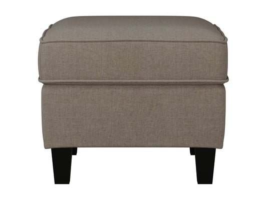 Taupe fabric ottoman with soft, textured upholstery and sturdy wooden legs, perfect for living room or bedroom decor. Ideal for extra seating or as a stylish footrest.