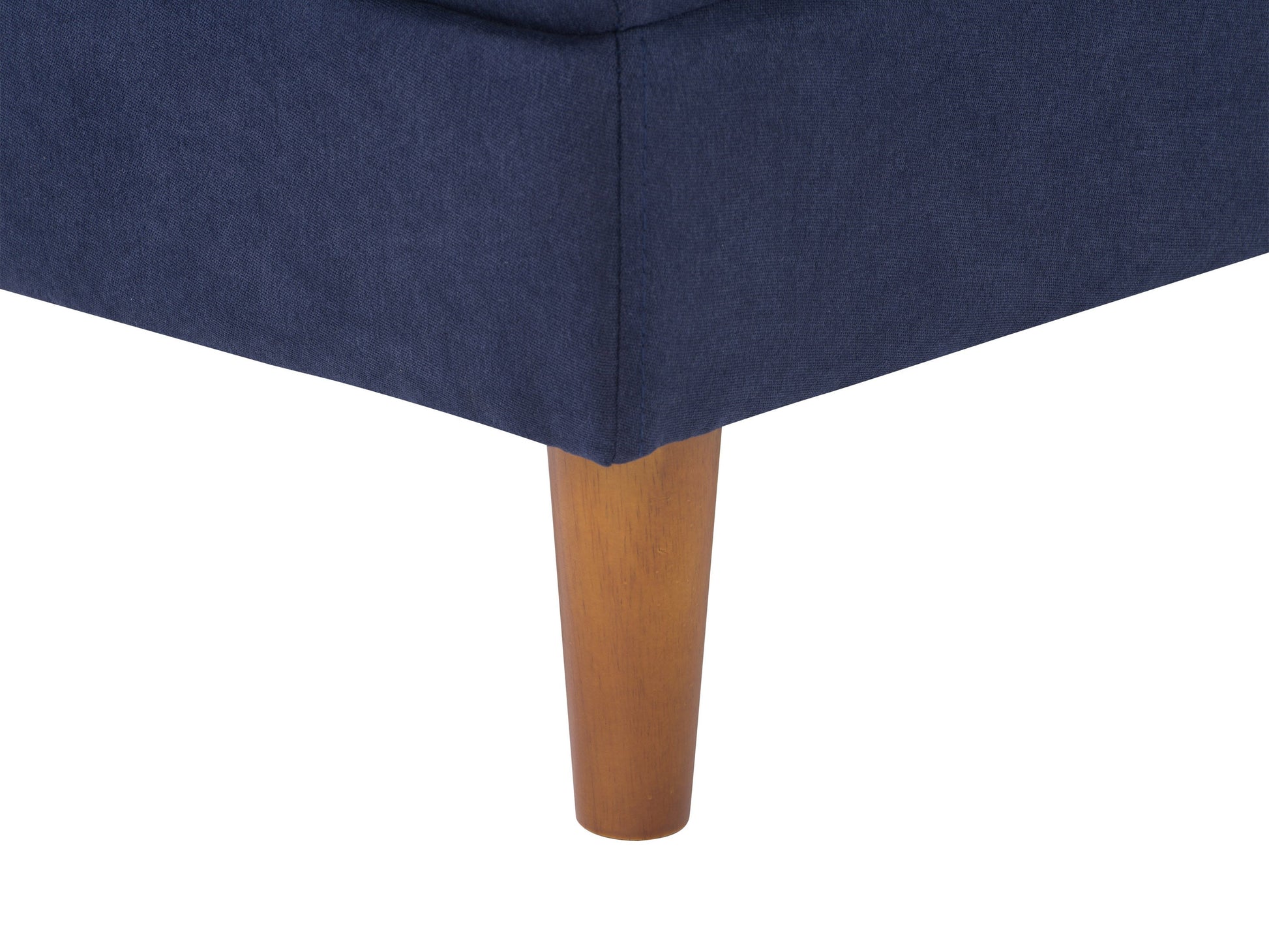 Navy blue mid-century modern ottoman with wooden legs, tufted fabric, and sleek design. Perfect for living room or bedroom decor.