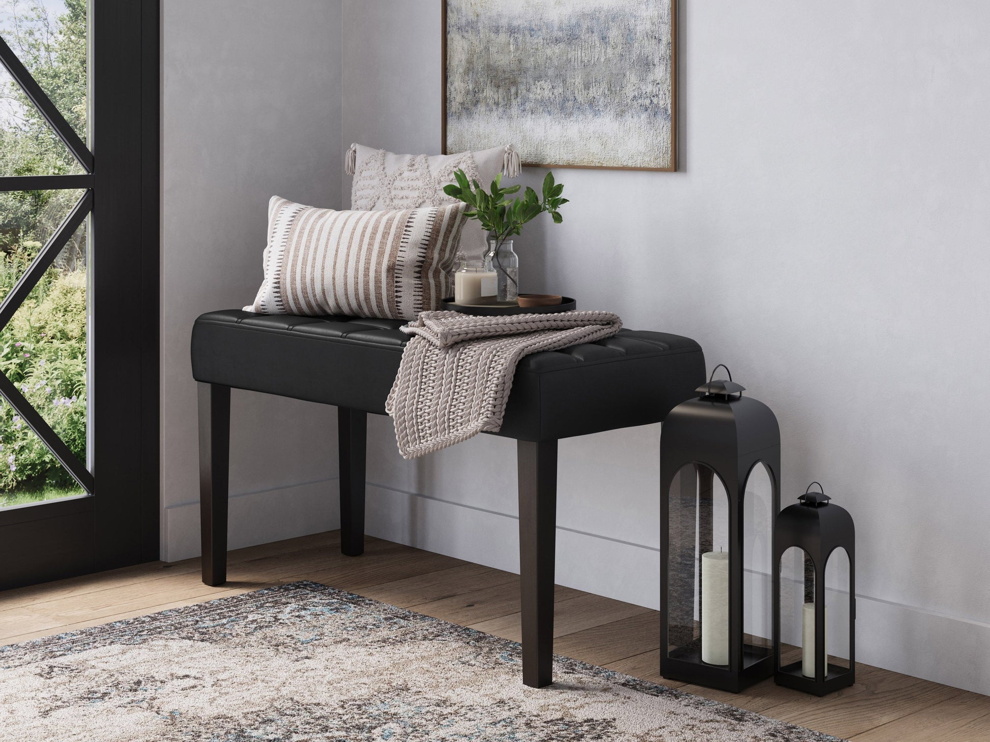 Black leather bench with sleek, modern design featuring a sturdy metal frame, tufted seat cushion, and minimalist style, perfect for contemporary living spaces or entryways.