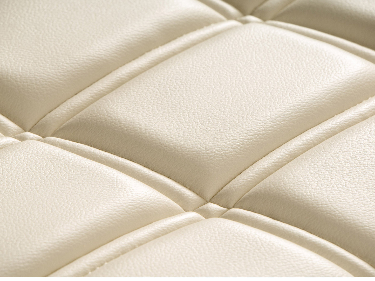 White leather bench with sleek design, polished chrome legs, and tufted cushion. Ideal for modern living rooms or entryways. Durable and stylish, perfect for contemporary home decor.