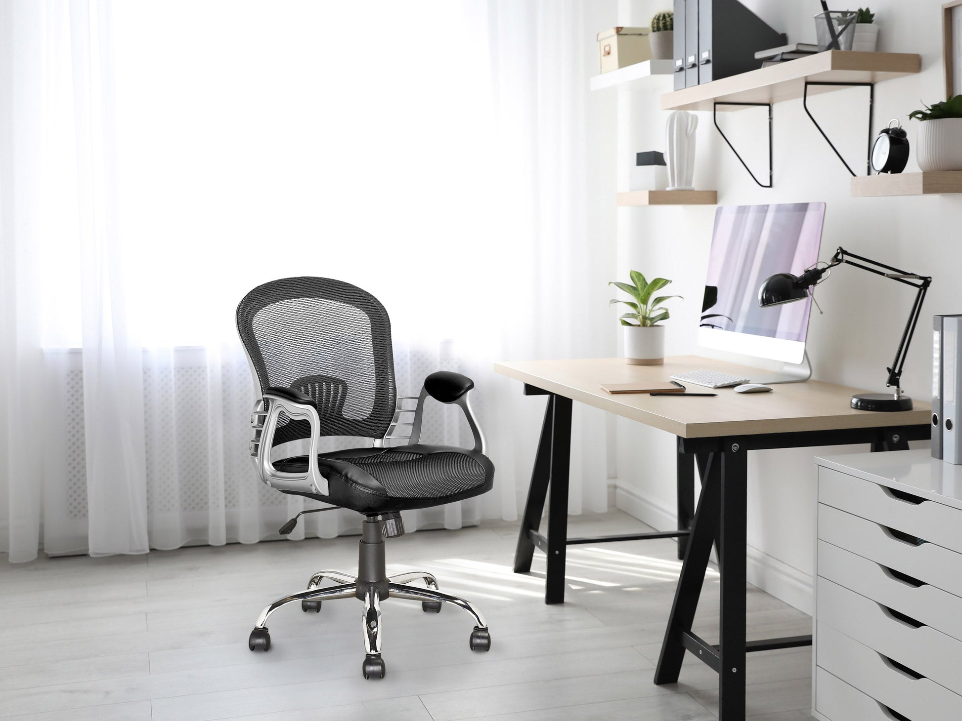 Black swivel office chair with ergonomic design, cushioned seat, adjustable height, and lumbar support. Features a sleek, modern look with a sturdy metal base and smooth-rolling casters. Ideal for home or office use.