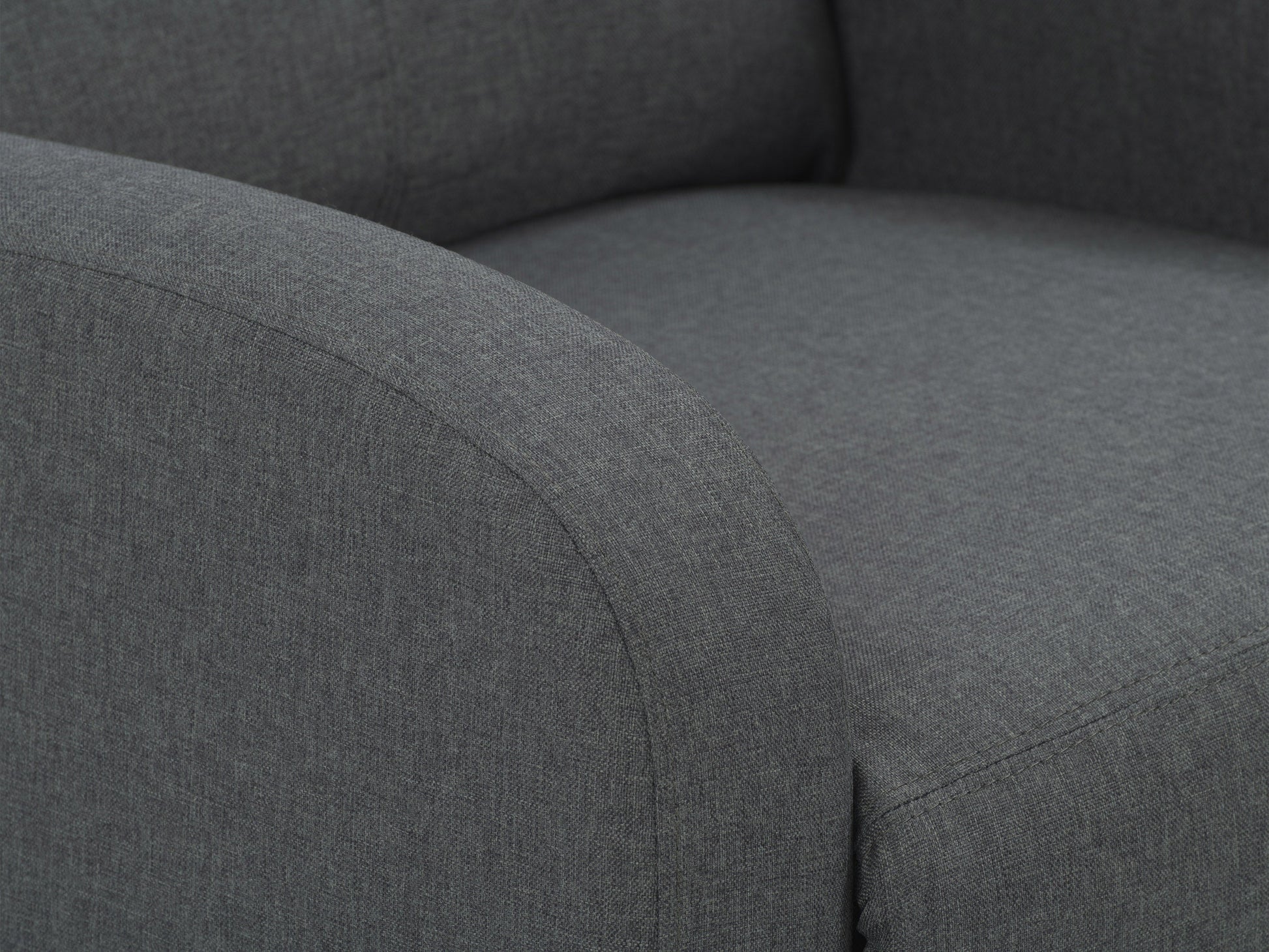 Dark grey push back recliner with plush cushioning, sleek armrests, and durable fabric upholstery. Ideal for living rooms, this comfortable and stylish chair features a reclining mechanism for ultimate relaxation.
