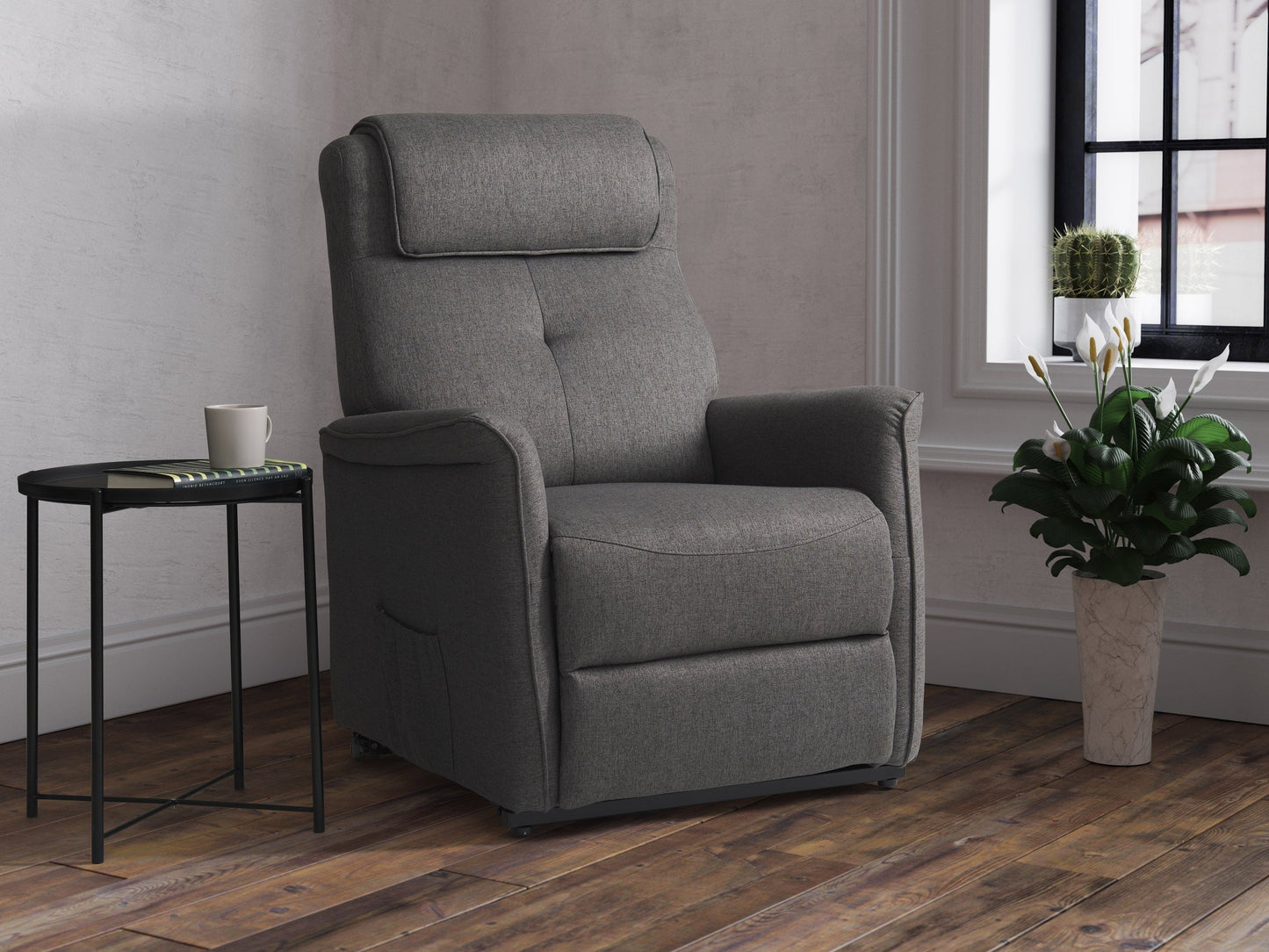 Medium grey power lift recliner with plush upholstery, ergonomic design, padded armrests, and remote control for easy adjustment. Ideal for elderly or mobility-challenged users seeking comfort and convenience.