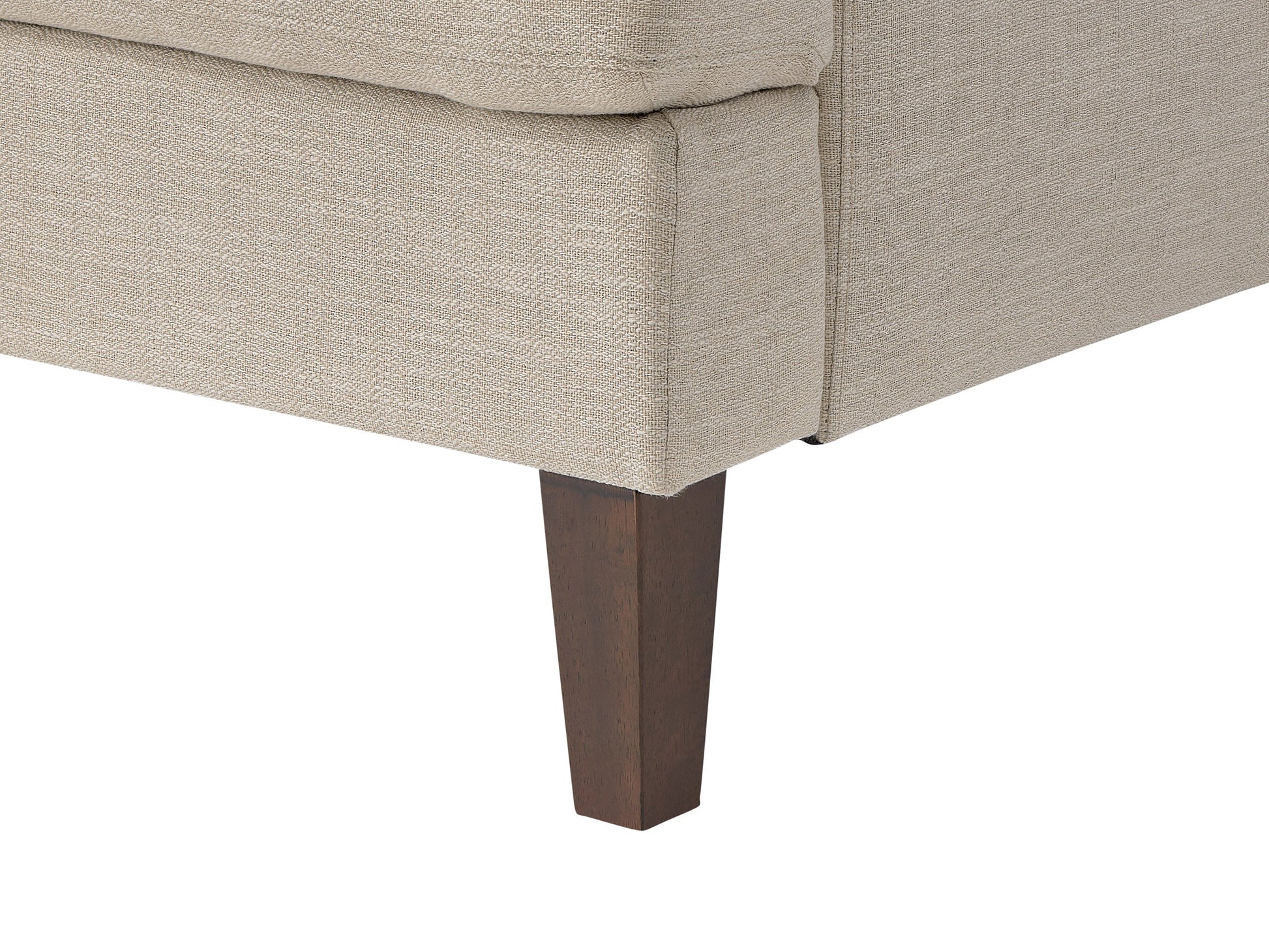 Beige mid-century armchair with wooden legs, tufted backrest, and smooth upholstery. Ideal for living rooms or offices, this stylish chair combines comfort with a retro design aesthetic.