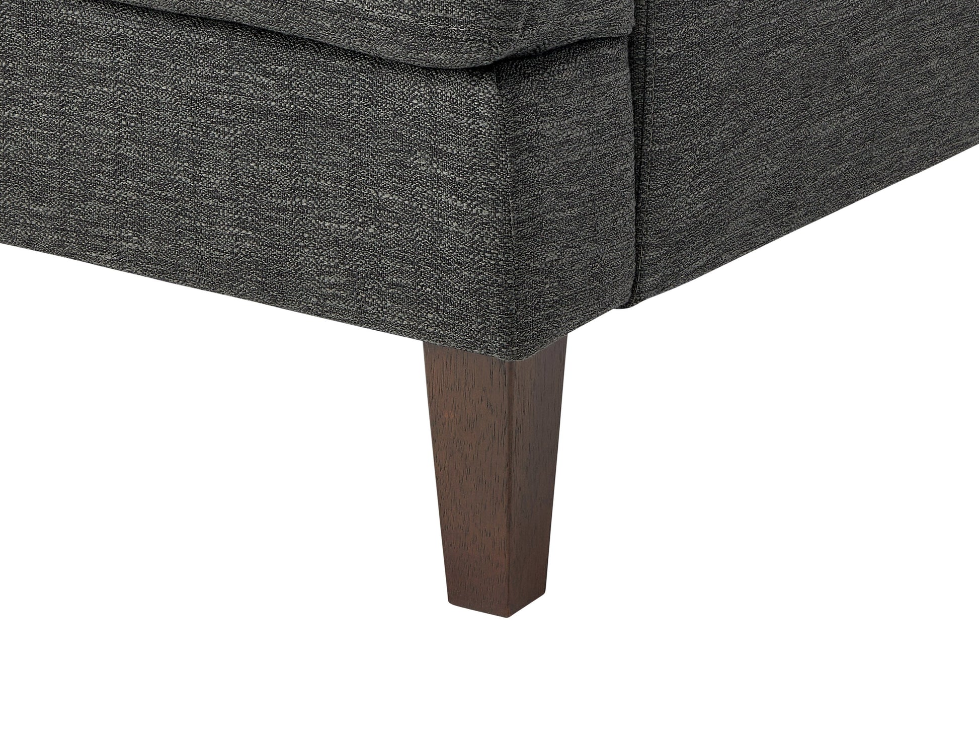 Dark grey mid-century armchair with wooden legs, upholstered in soft fabric, featuring a tufted backrest and padded seat, ideal for modern living rooms or offices.