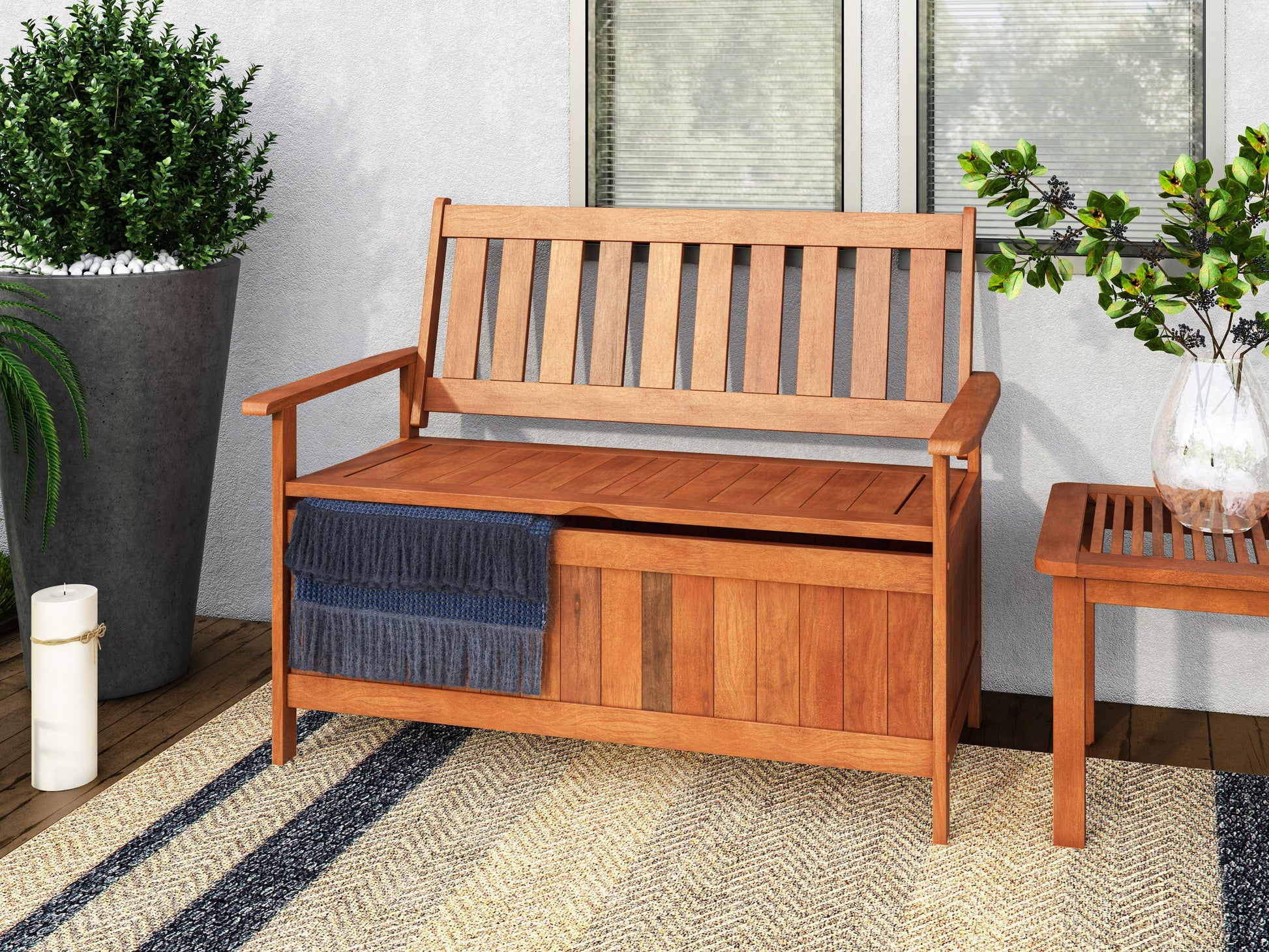 Brown wooden patio storage bench with slatted backrest, armrests, and spacious storage compartment beneath the seat. Perfect for outdoor seating and storage solutions.