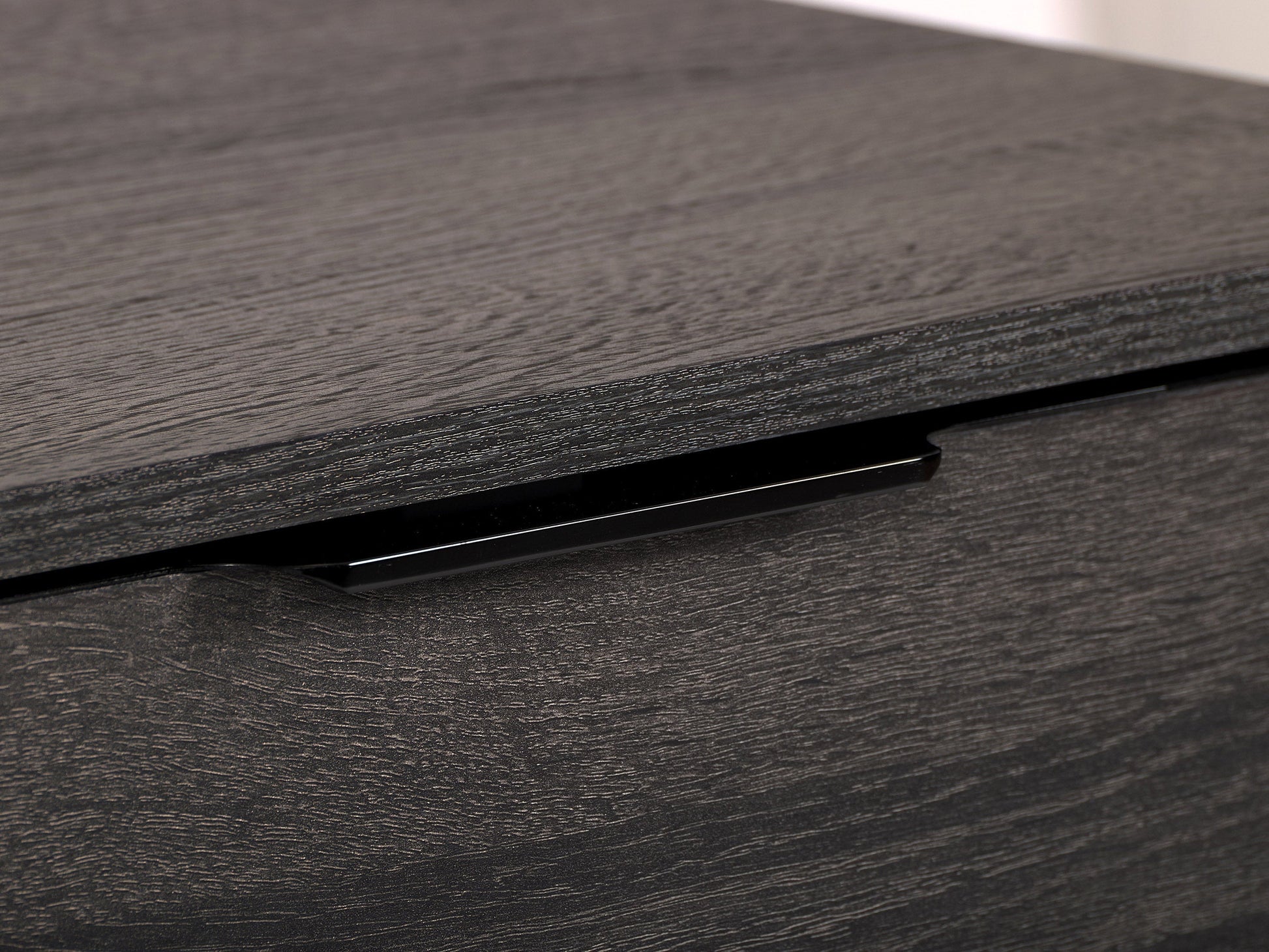 Dark grey TV bench with open and closed storage compartments, suitable for TVs up to 85 inches. Features sleek design, sturdy construction, and ample space for media devices and accessories.