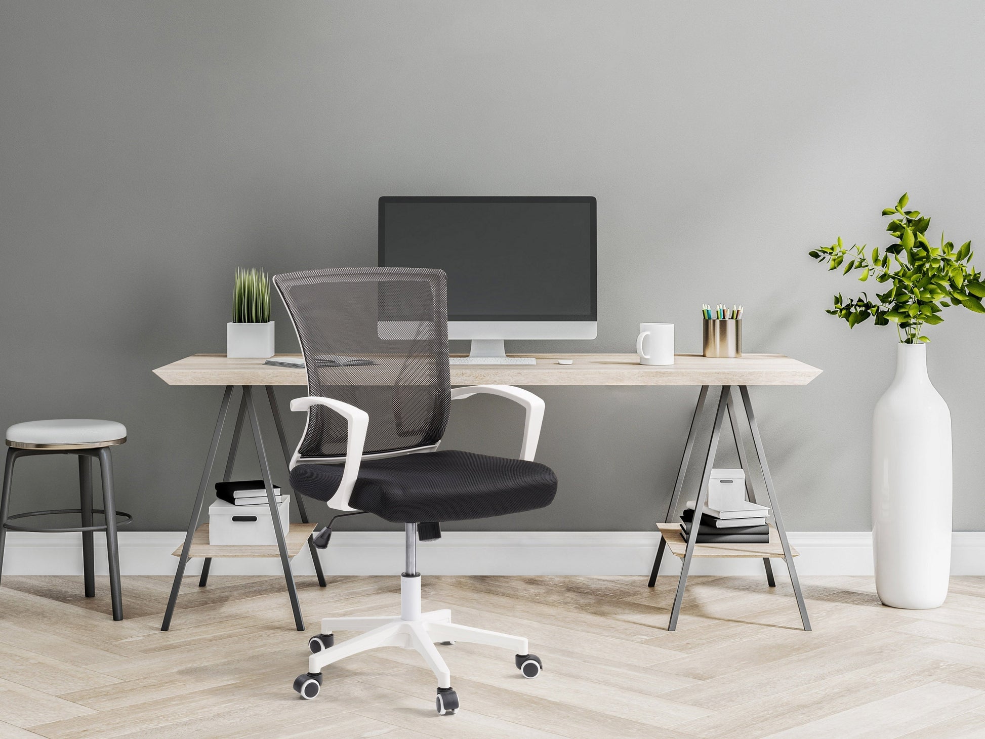 Ergonomic black mesh task chair with adjustable armrests, white frame, and lumbar support. Features breathable mesh back, cushioned seat, and swivel base with wheels for mobility. Ideal for home office use.