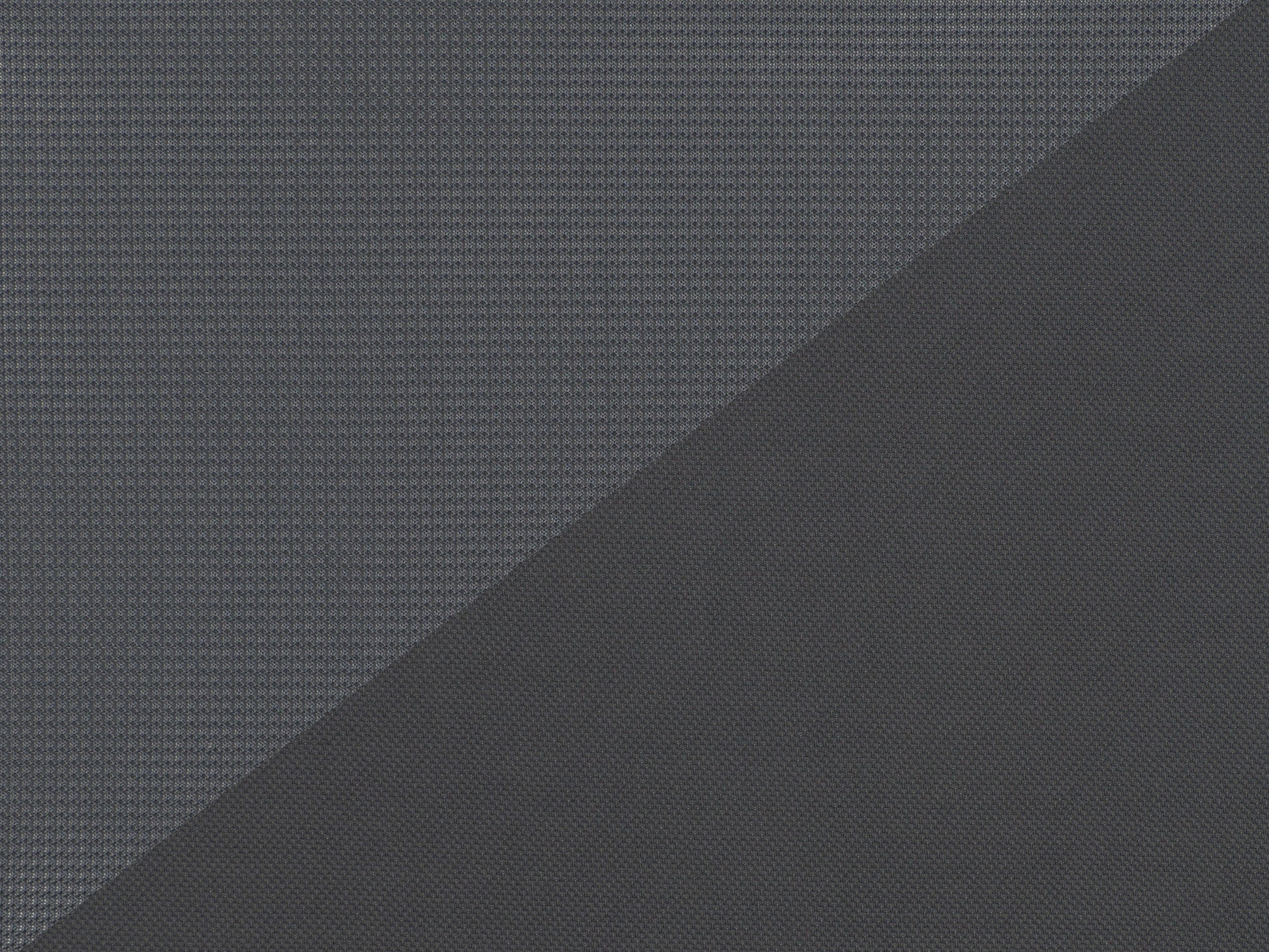 Grey mesh office chair with ergonomic design, adjustable armrests, lumbar support, and swivel base. Ideal for home or office use, providing comfort and breathability for long hours of work.