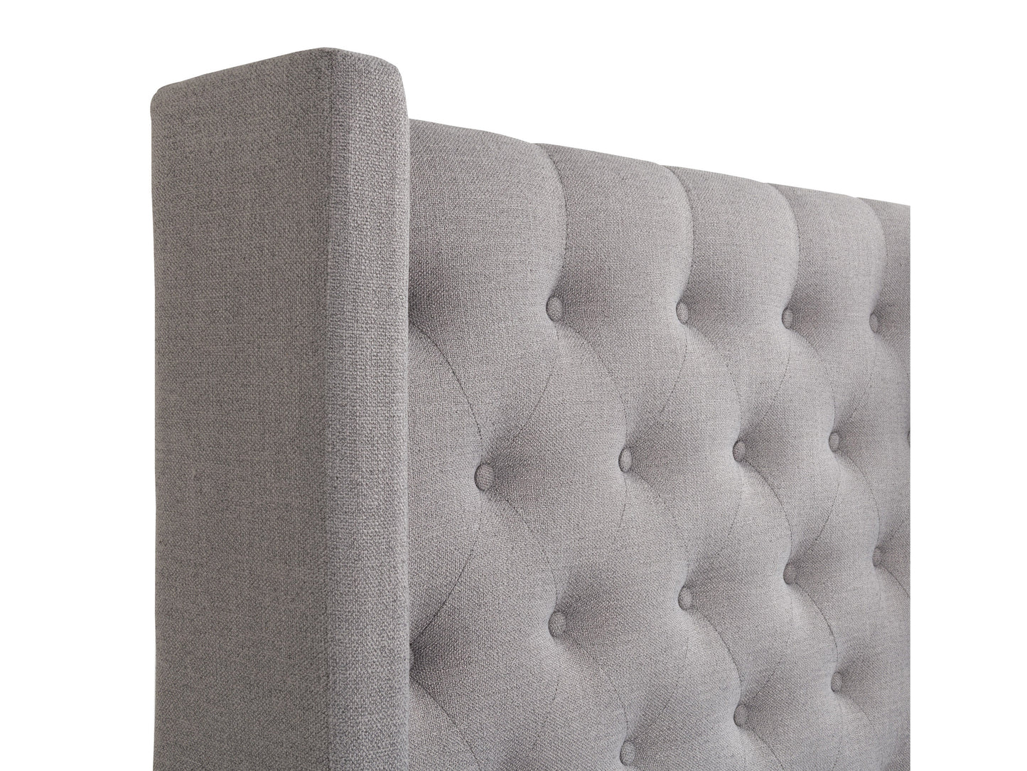 Tufted twin bed with beige upholstered headboard, wooden frame, and button-tufted details, perfect for single sleepers.