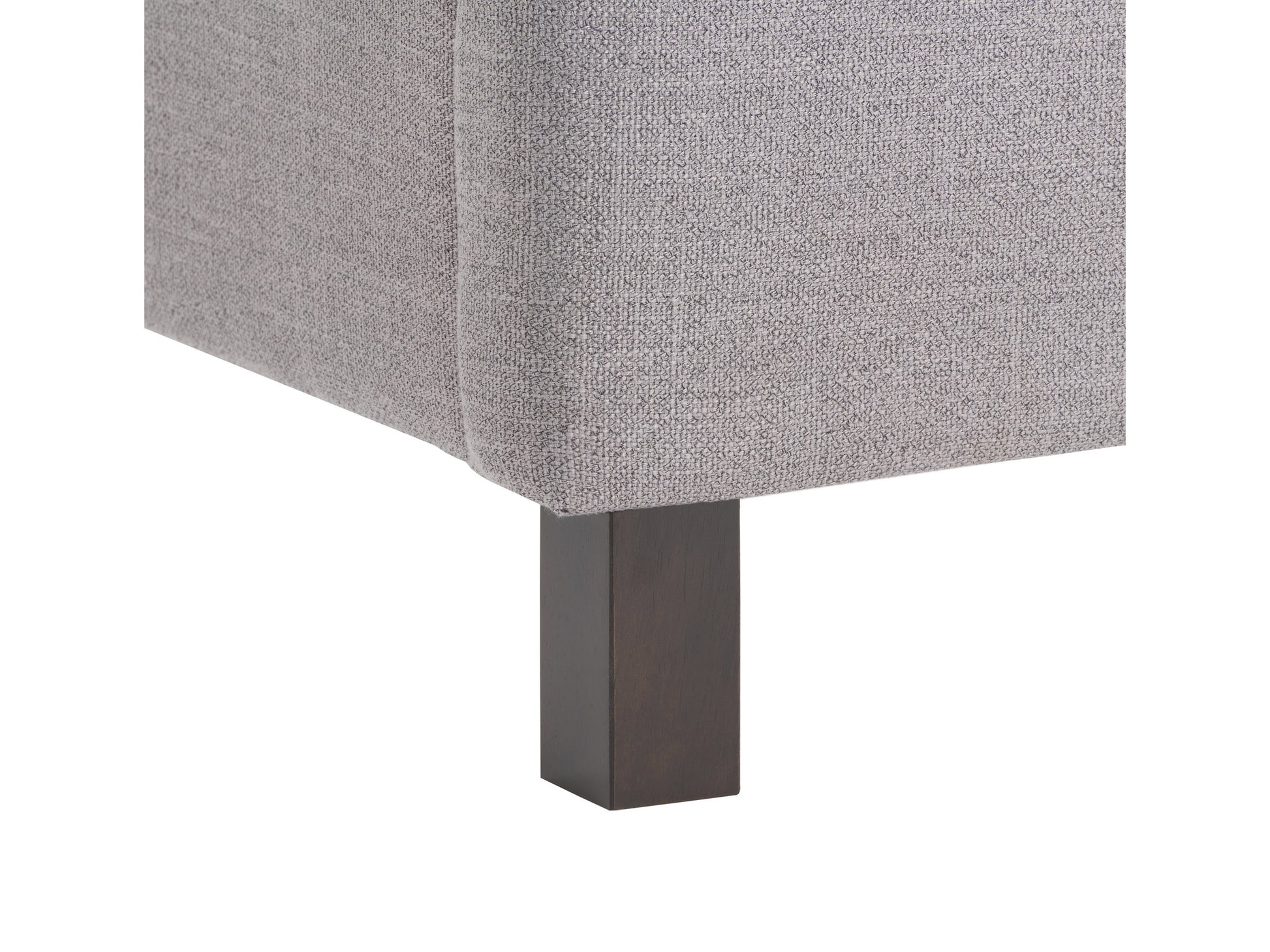 Modern tufted twin bed in light gray fabric with button detailing on headboard, featuring wooden legs and a sleek, minimalist design perfect for contemporary bedrooms.