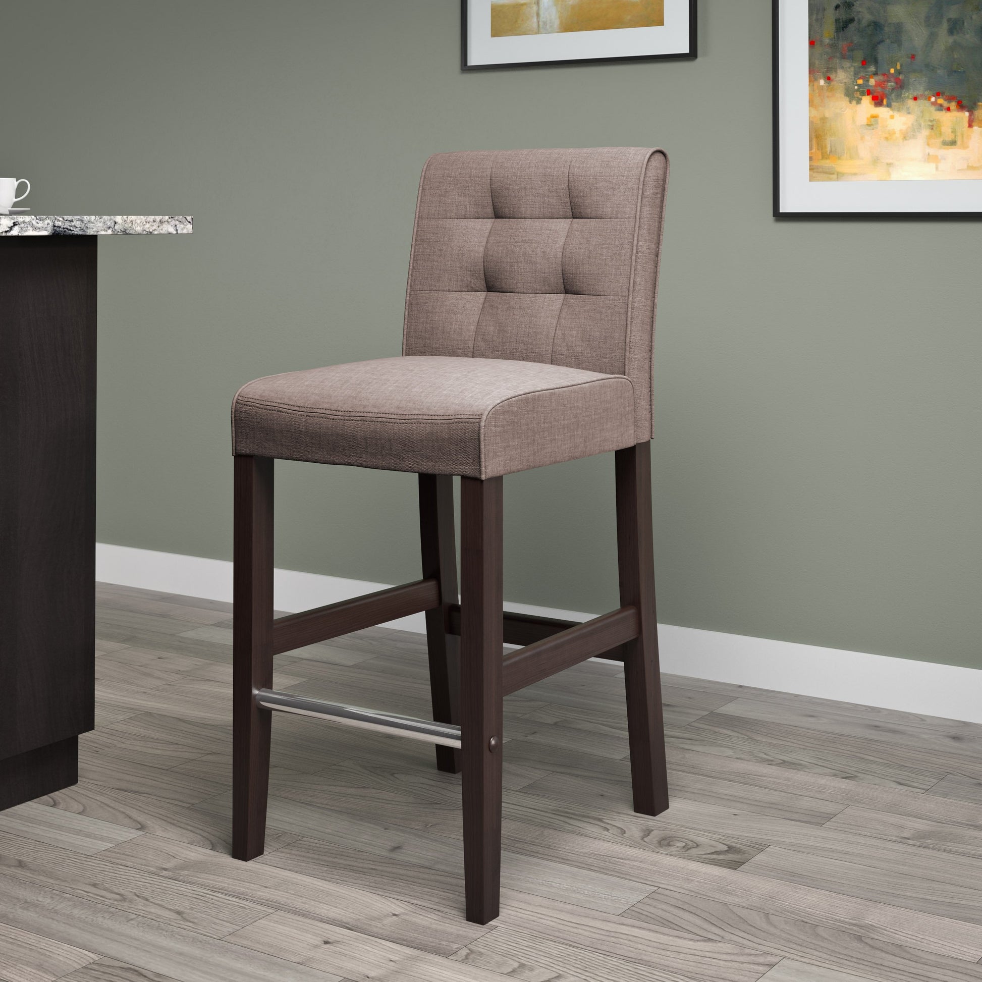 Brown bar stool with cushioned seat, dark wood legs, and footrest; upholstered in rich brown leather, perfect for bar height counters and modern kitchen islands.