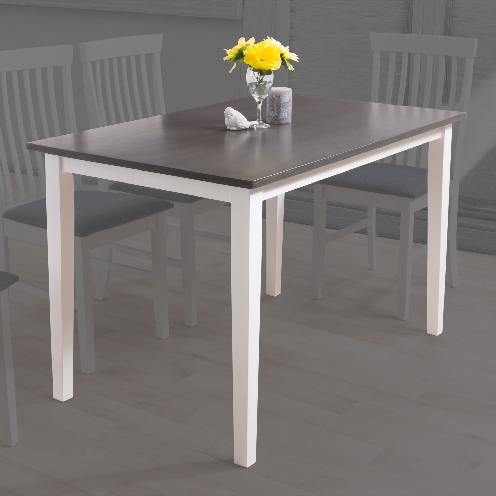 Grey and white dining table with sleek rectangular surface, modern metal legs, and smooth finish, perfect for contemporary dining rooms.