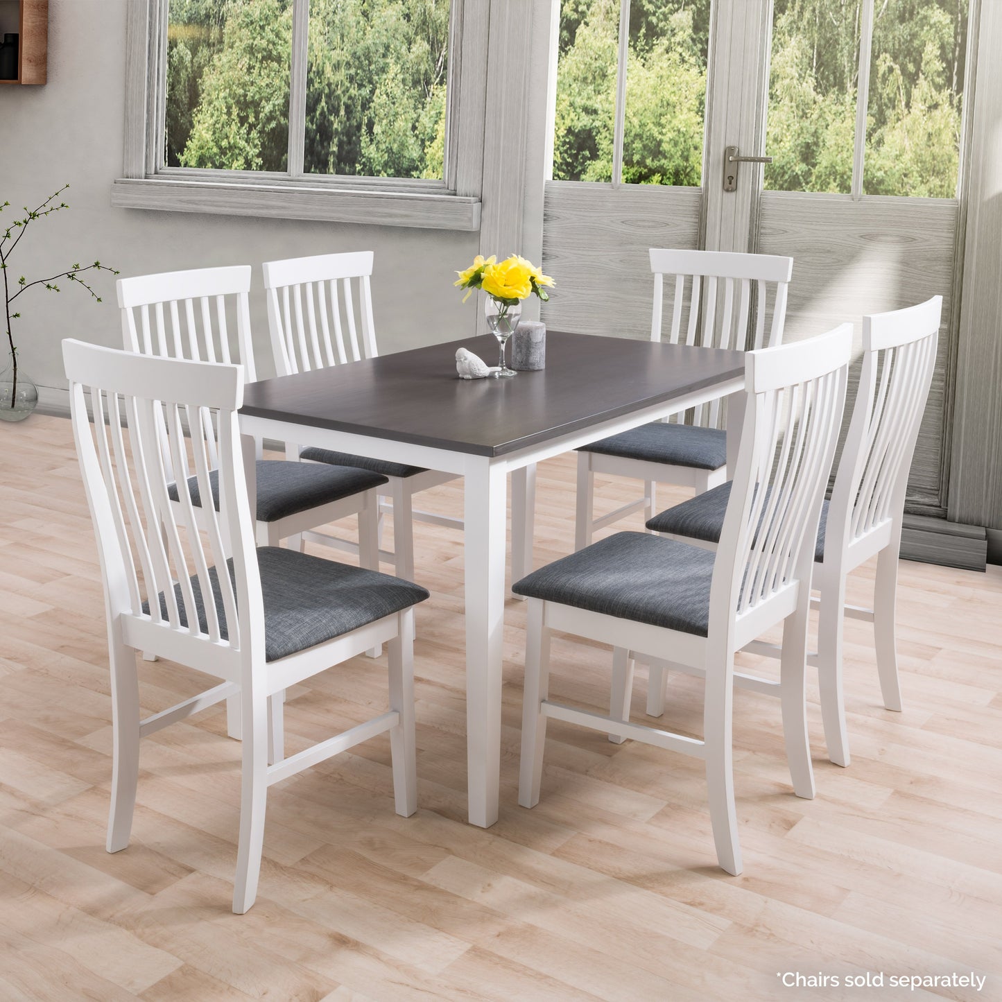 Grey and white dining table with sleek, modern design, featuring a smooth grey tabletop and sturdy white legs, ideal for contemporary dining rooms and kitchens.