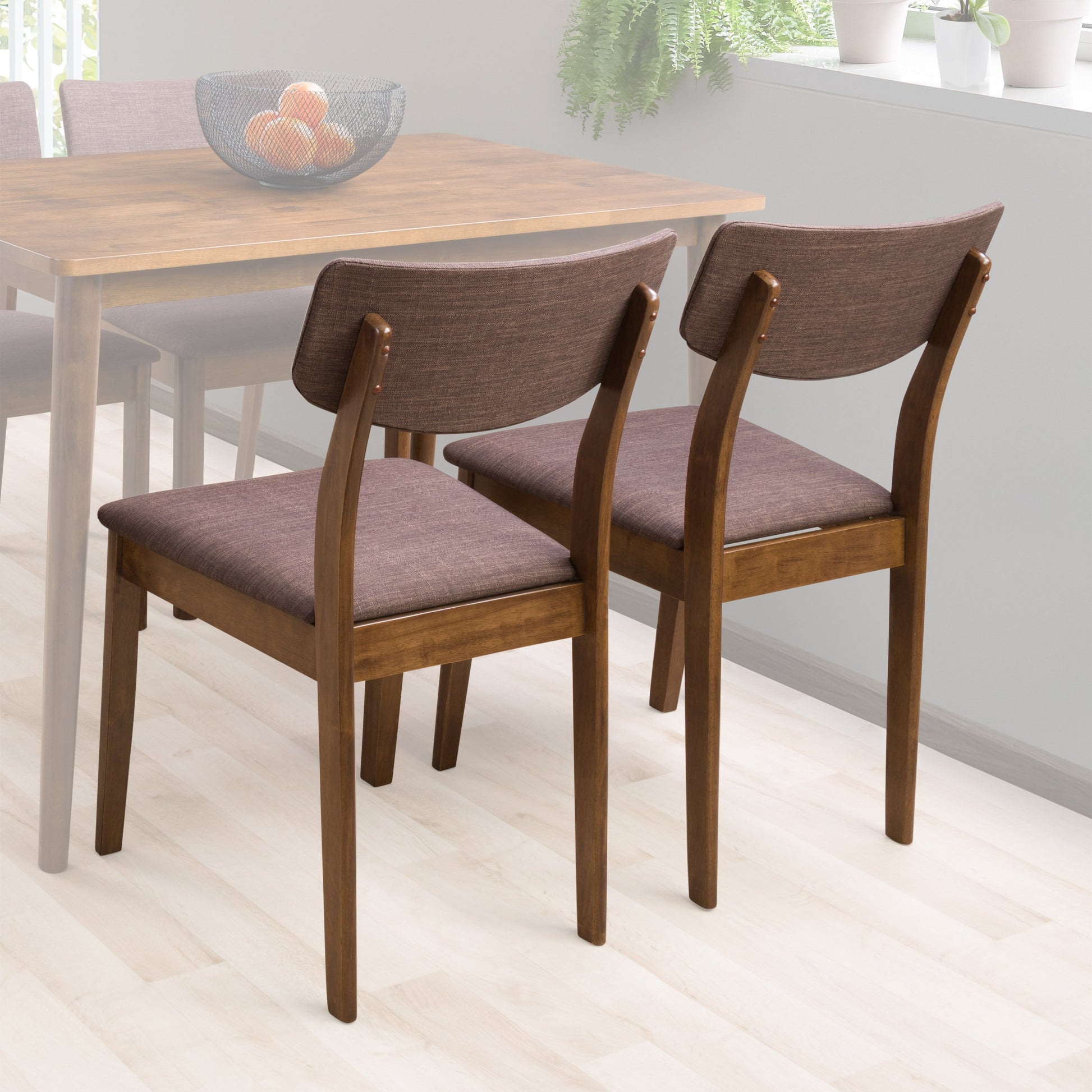 Set of 2 walnut dining chairs with curved wooden backrests, upholstered seats in light gray fabric, and sleek tapered legs, perfect for modern dining rooms or kitchens.