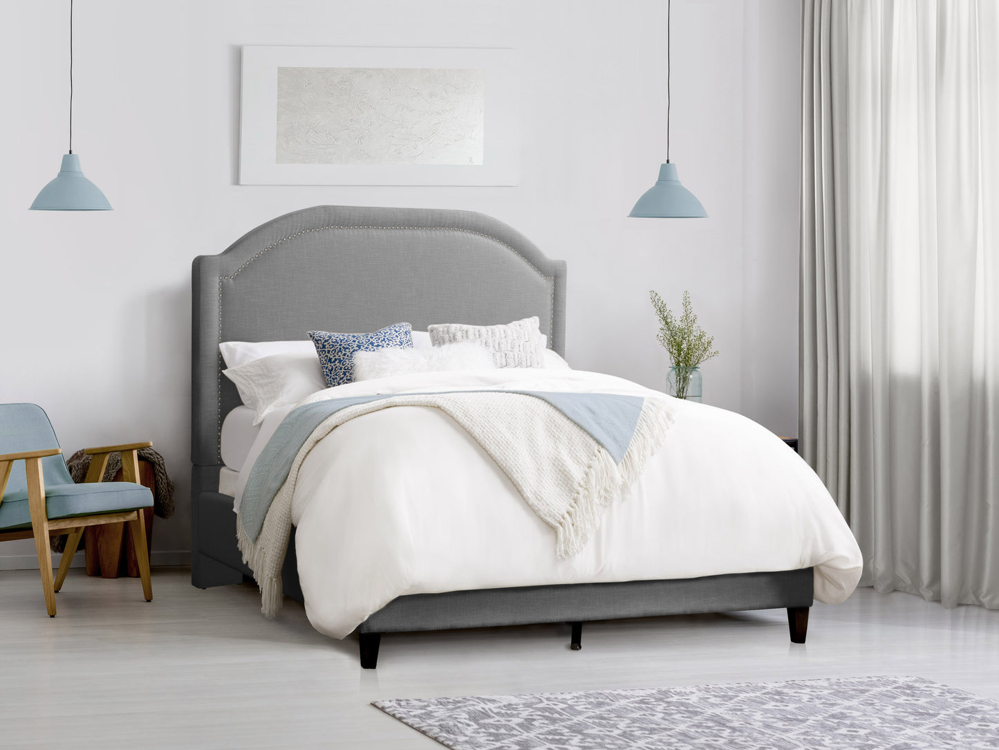 Modern upholstered double bed with gray fabric headboard and footboard, wooden legs, and a minimalist design. Ideal for contemporary bedrooms seeking a stylish and comfortable full-size bed.