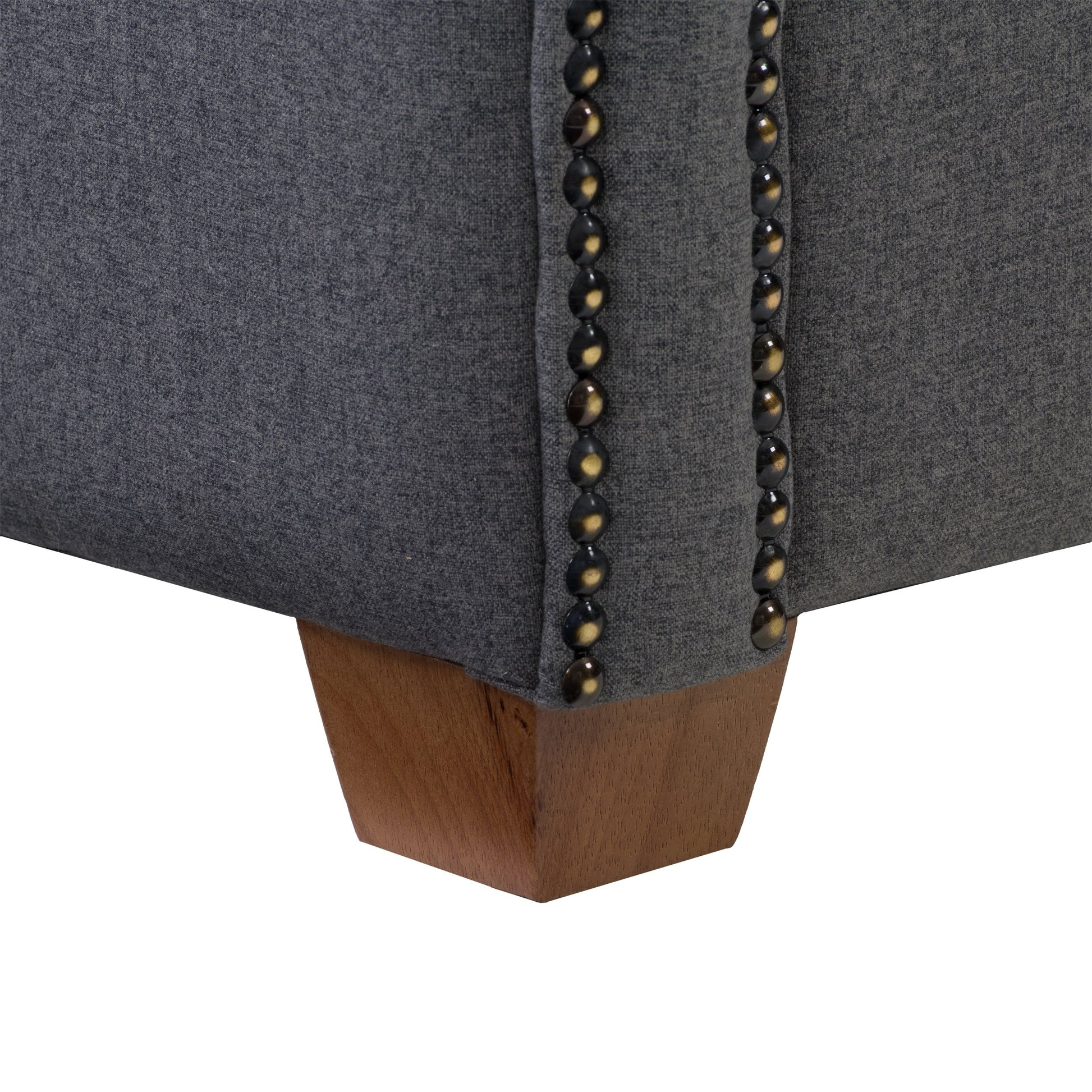 Grey arm chair with plush cushioned seat and backrest, featuring sleek wooden legs and soft fabric upholstery. Perfect for modern living rooms or offices, offering both comfort and style.