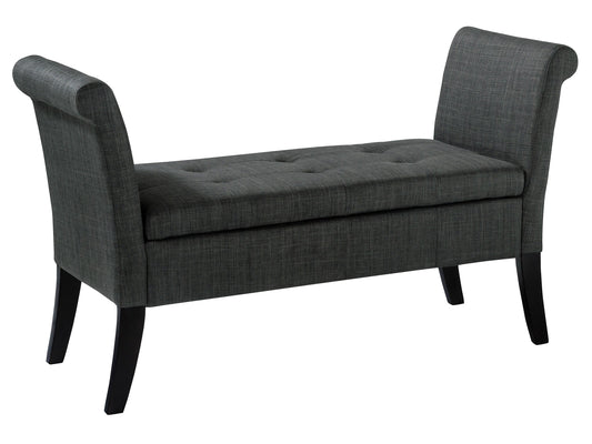 Gray upholstered storage bench with wooden legs, tufted seat, and armrests. Ideal for entryways or bedrooms, offering both seating and storage space. Modern design with neutral tones to match various decor styles.