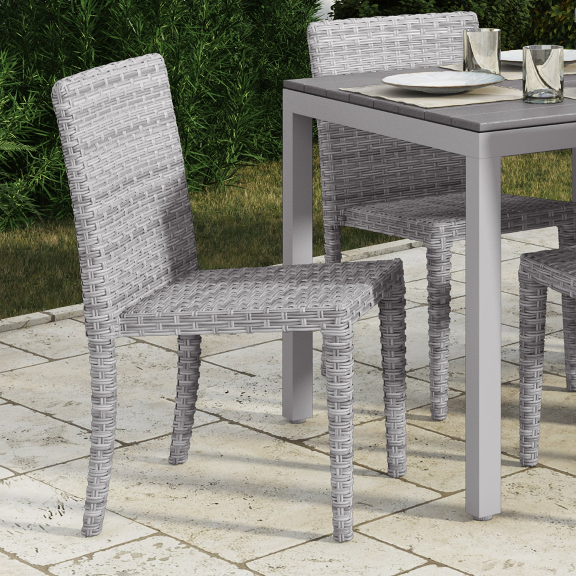 Set of four black and white patio dining chairs with cushioned seats, sleek metal frames, and modern design, perfect for outdoor dining and entertaining.