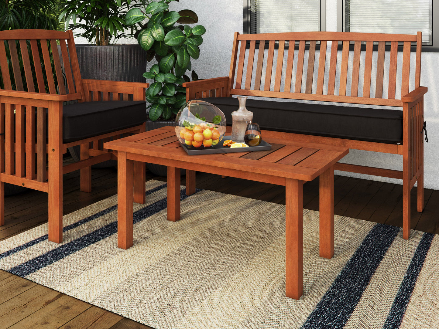 Brown hardwood outdoor coffee table with slatted top and sturdy legs, ideal for patio or garden use. Durable wood construction with natural grain texture, perfect for outdoor gatherings and relaxation.