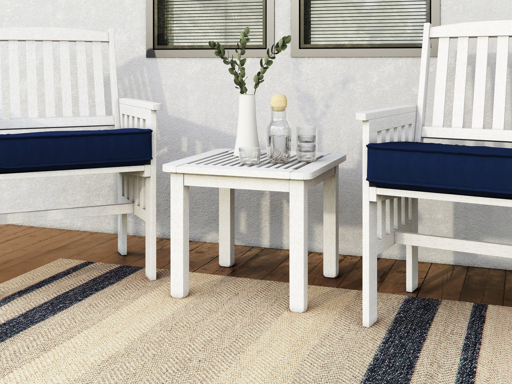 Washed white hardwood outdoor side table with slatted top, sturdy legs, and weather-resistant finish, ideal for patios and gardens.