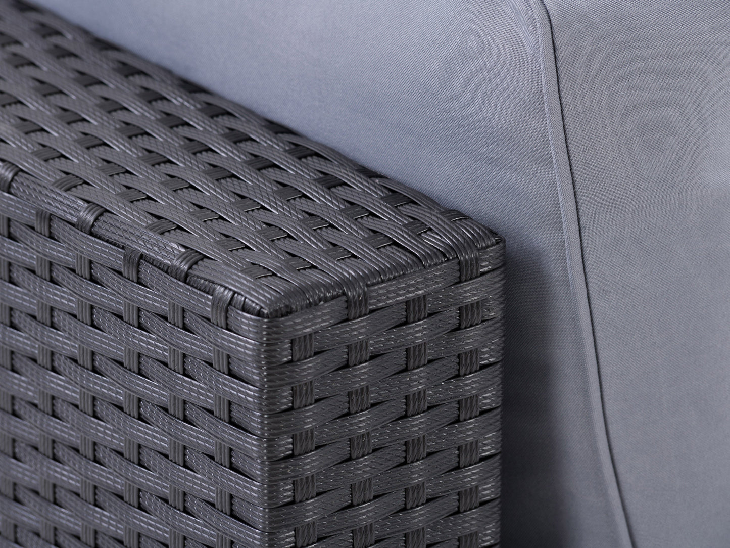 Wicker patio armchair with beige cushions, featuring a sturdy aluminum frame and intricate wicker weave design, ideal for outdoor relaxation and garden decor.