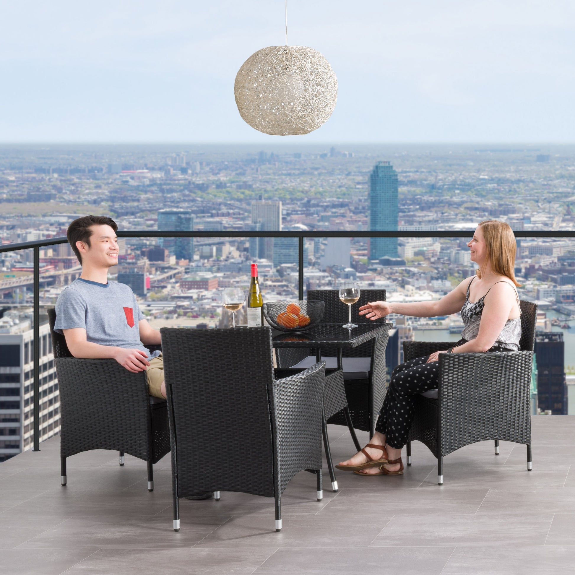 Modern 5-piece patio dining set with a rectangular glass table and four cushioned chairs in beige and brown wicker, featuring weather-resistant materials and a sleek design perfect for outdoor spaces.